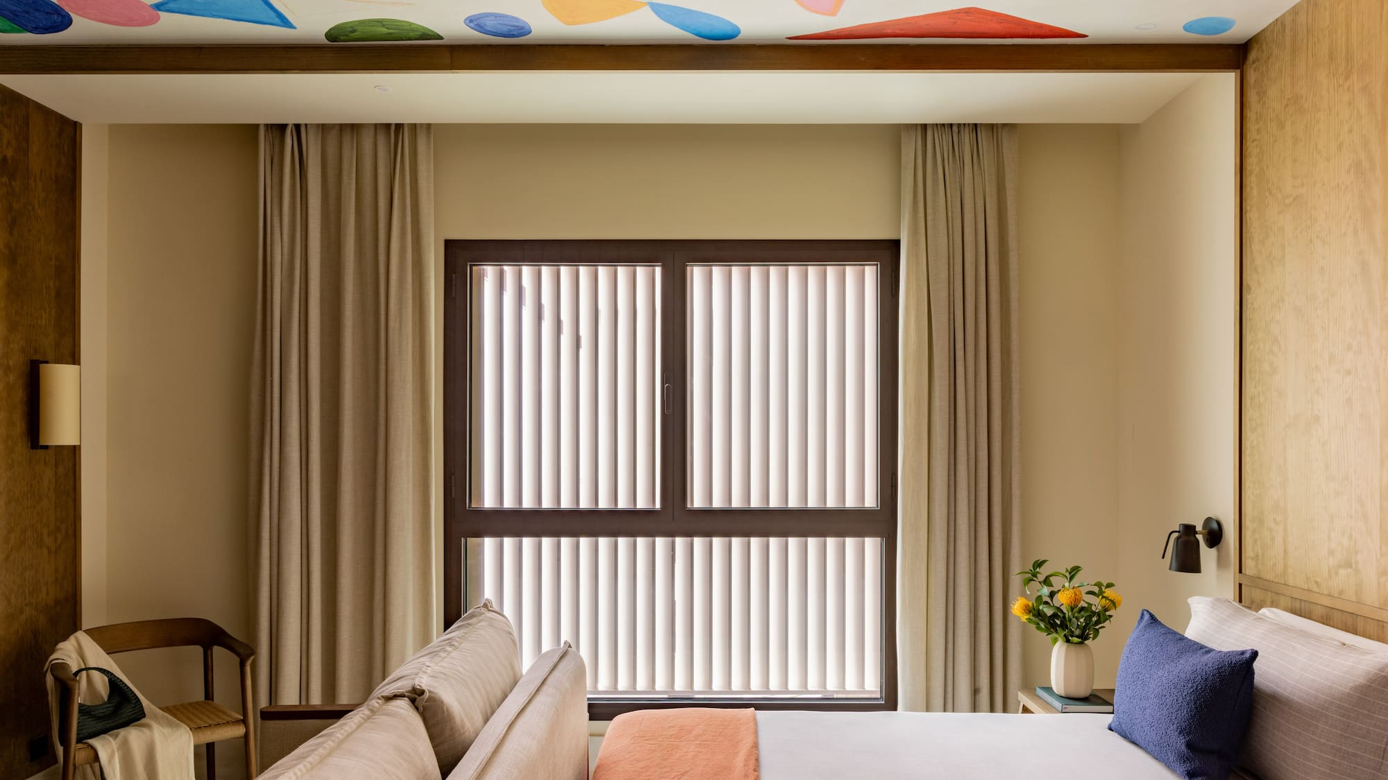 a room with a bed and a window