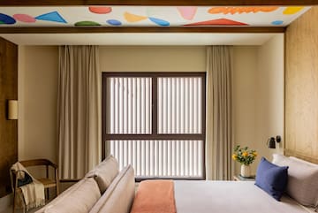 a room with a bed and a window