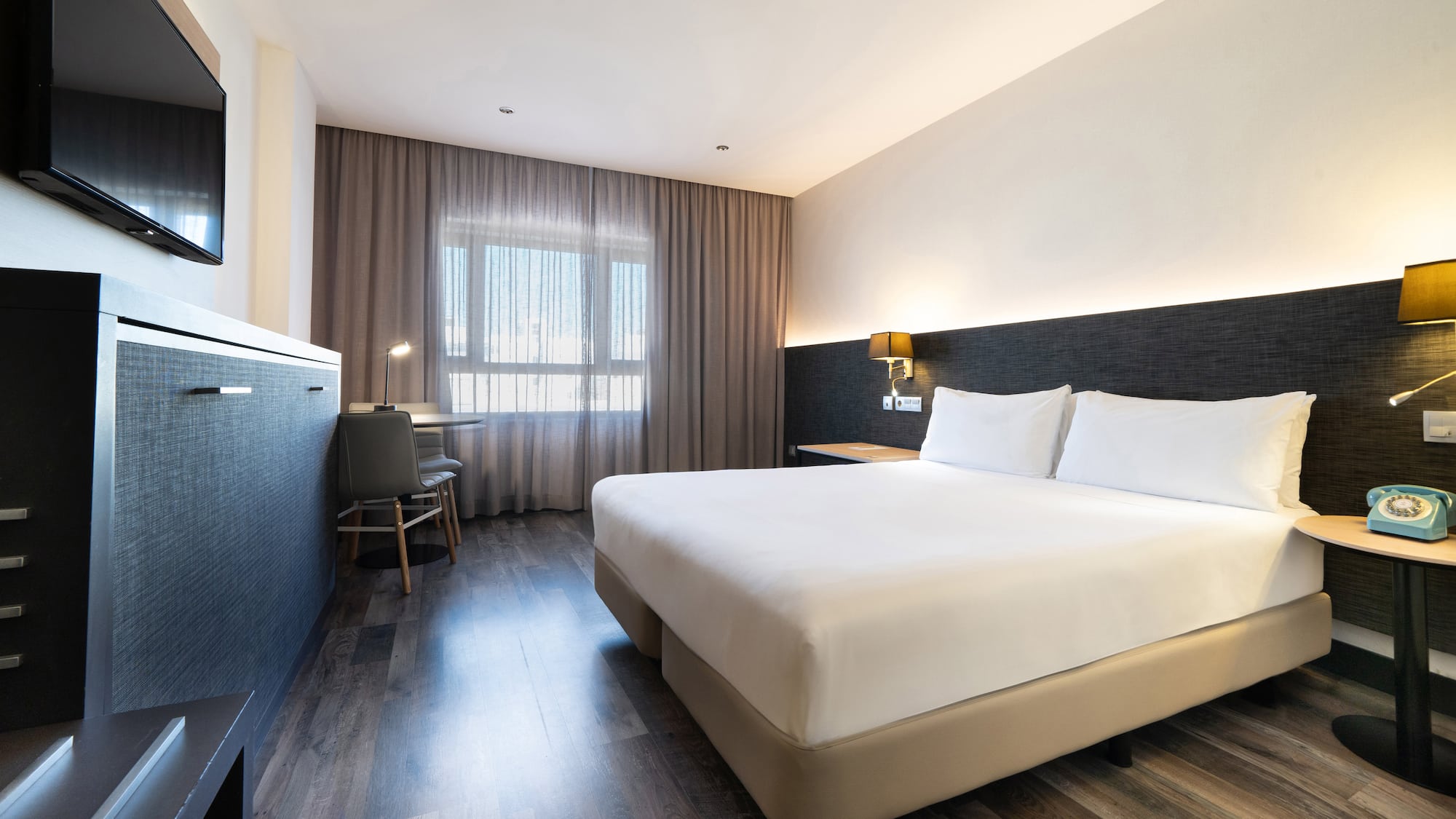 a room with a bed and a desk