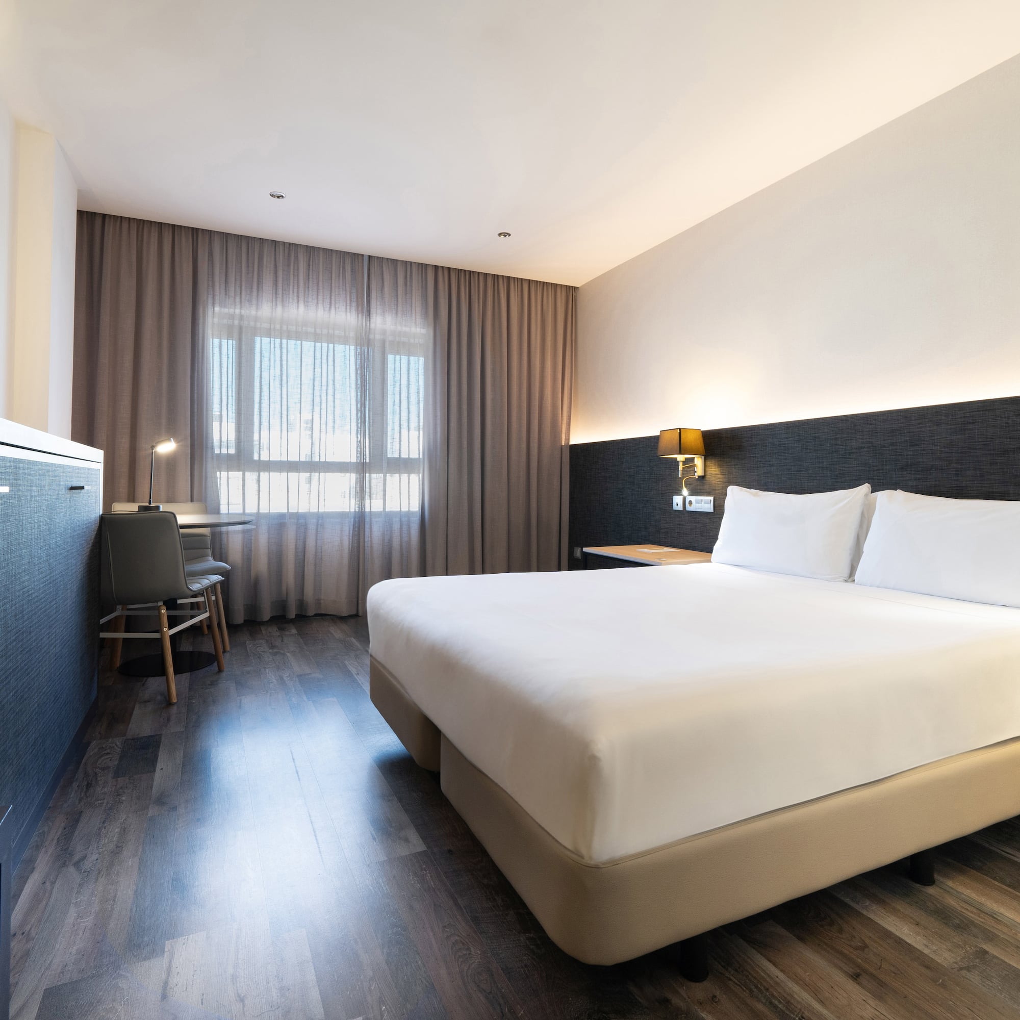 a room with a bed and a desk