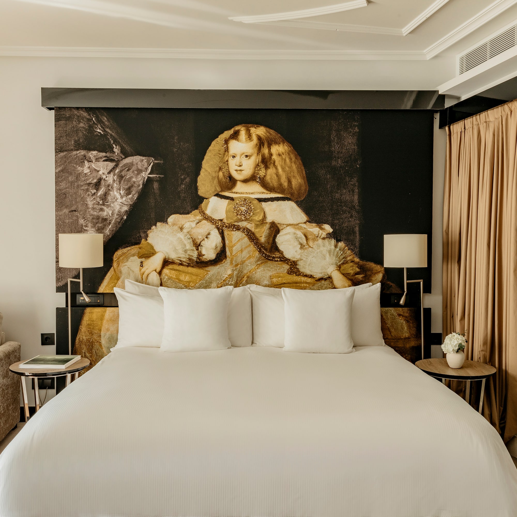 a bed with a large picture of a woman