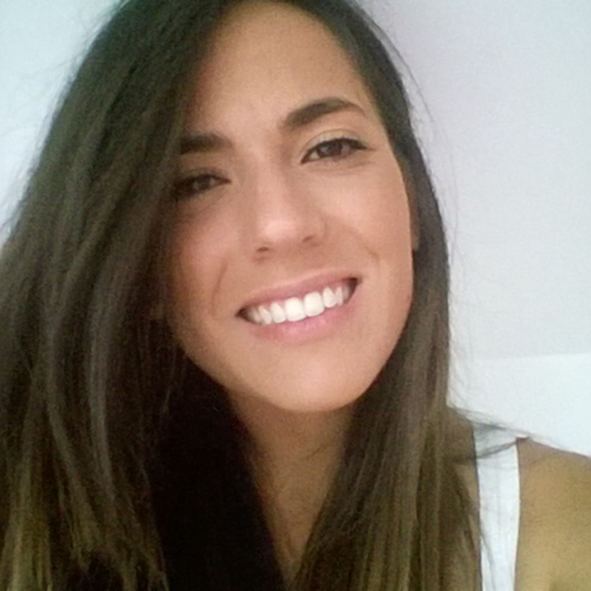 a woman smiling for a selfie