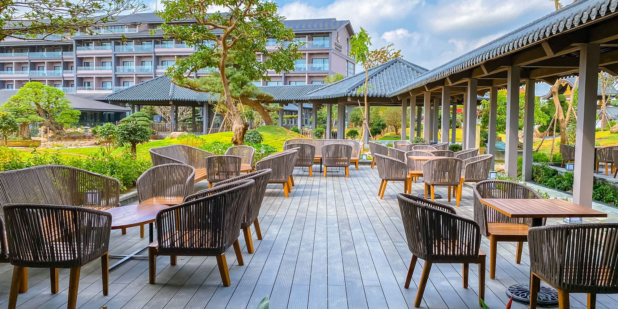 a patio area with chairs and tables
