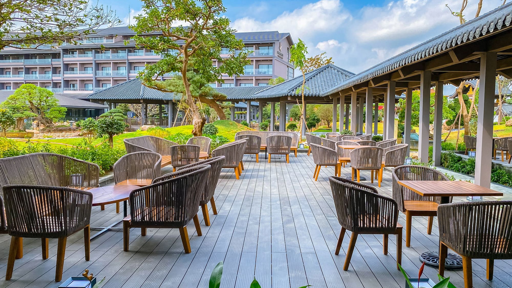 a patio area with chairs and tables