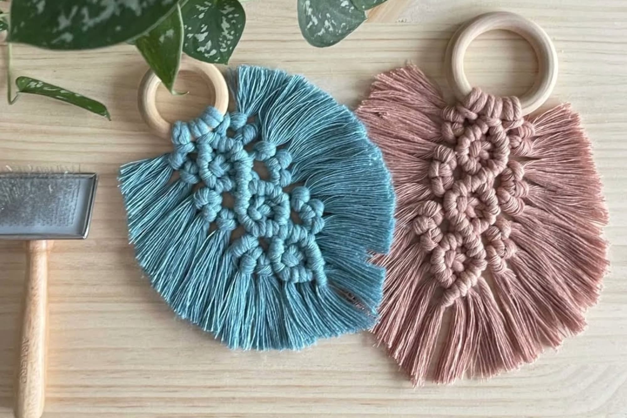 a pair of blue and pink macrame objects
