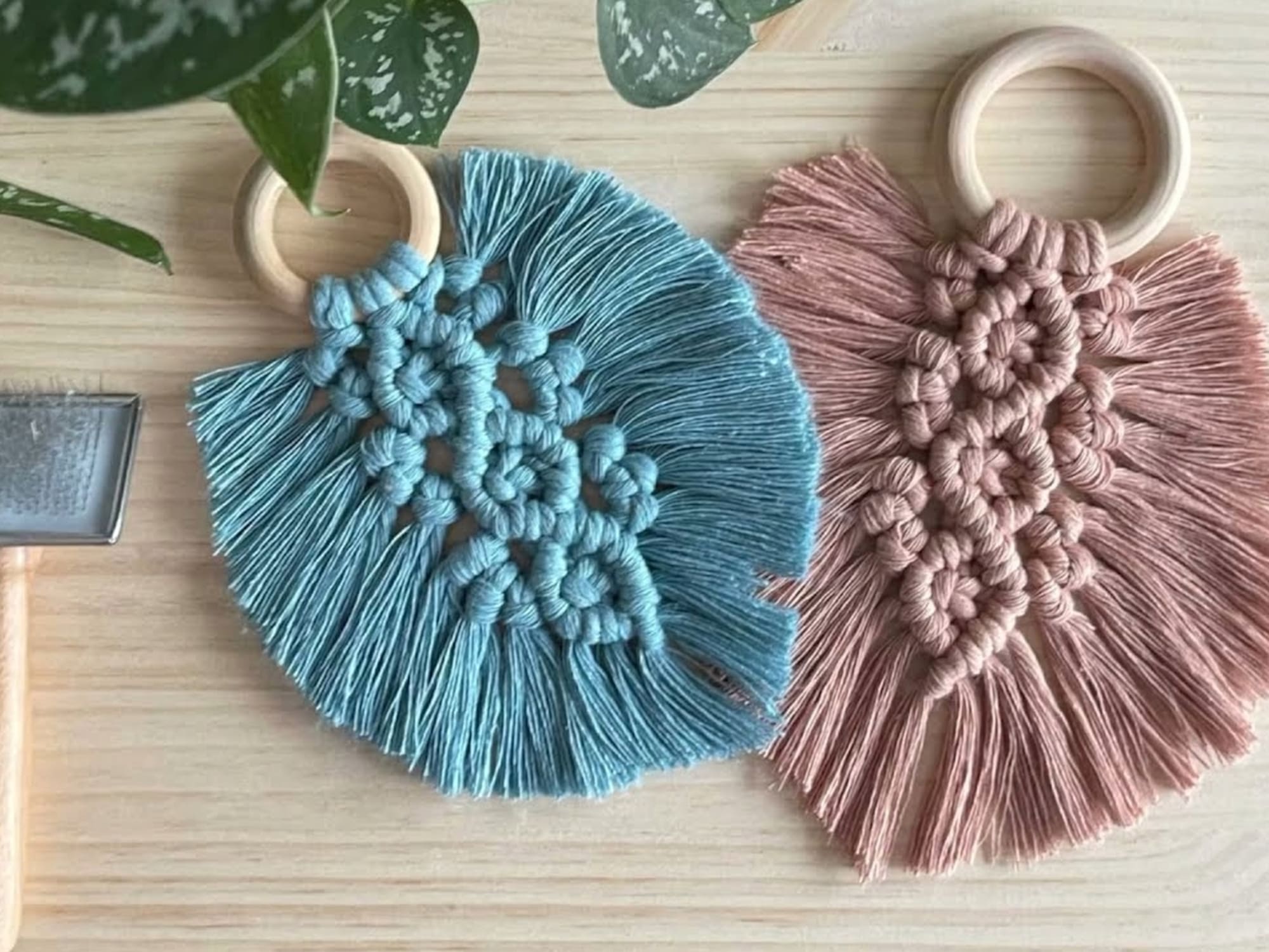 a pair of blue and pink macrame objects