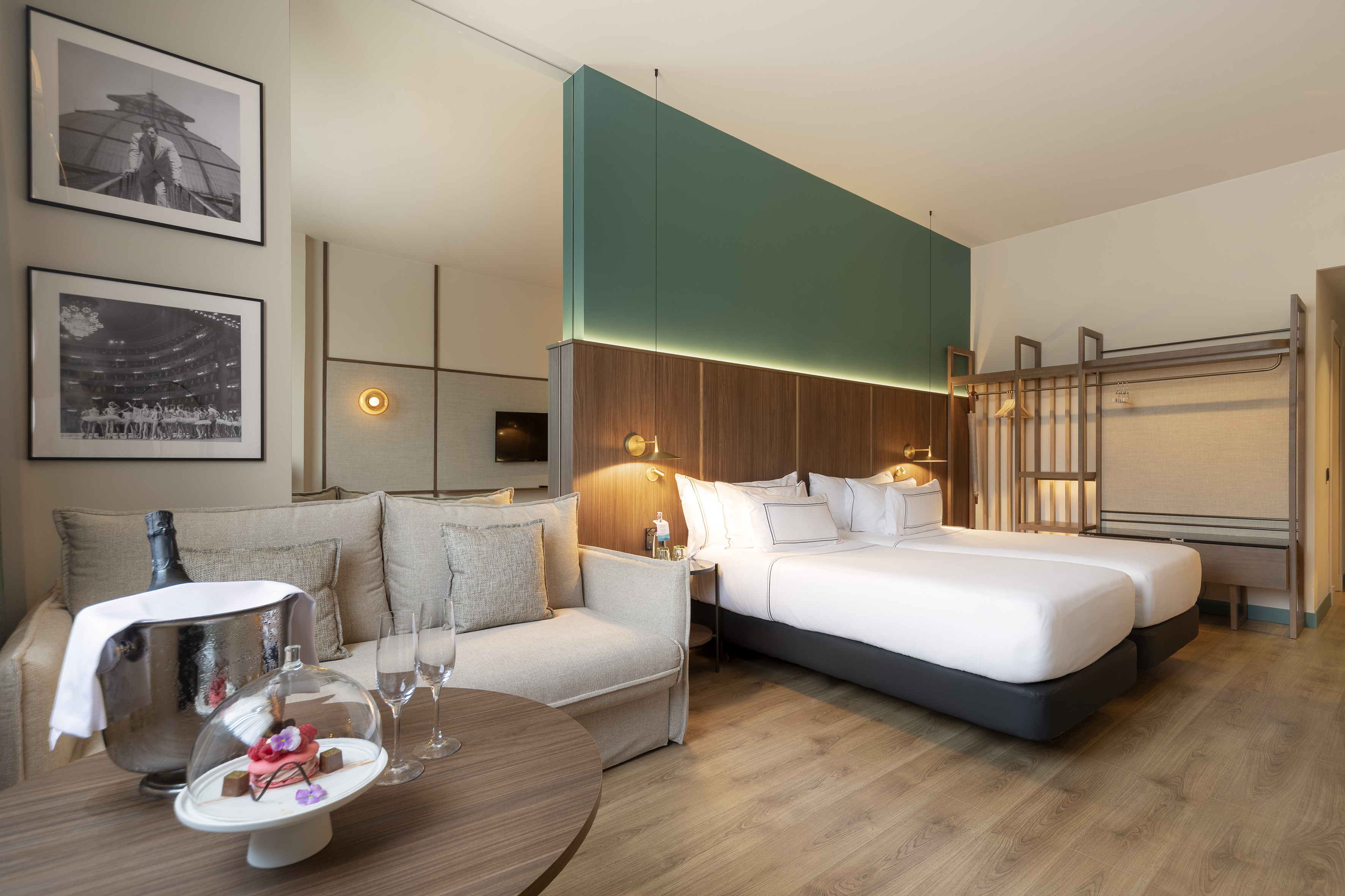 a room with a bed and couches