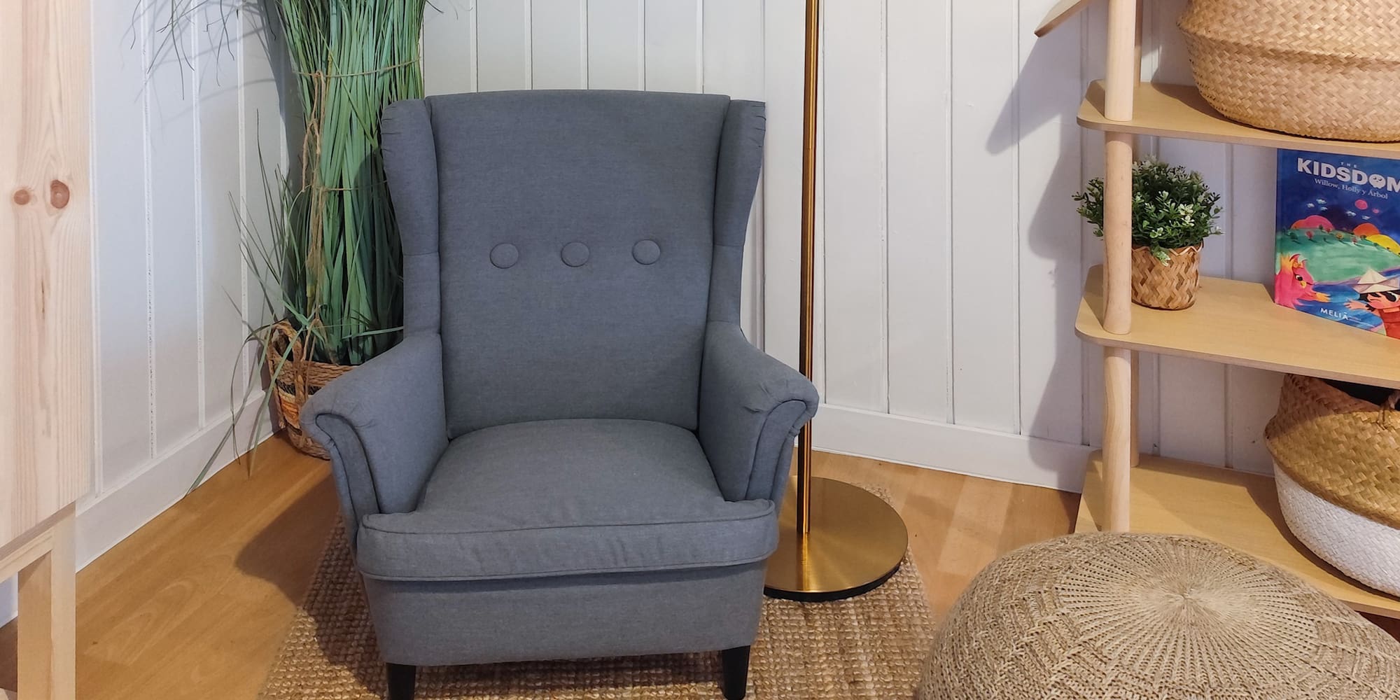 a chair and a floor lamp in a room