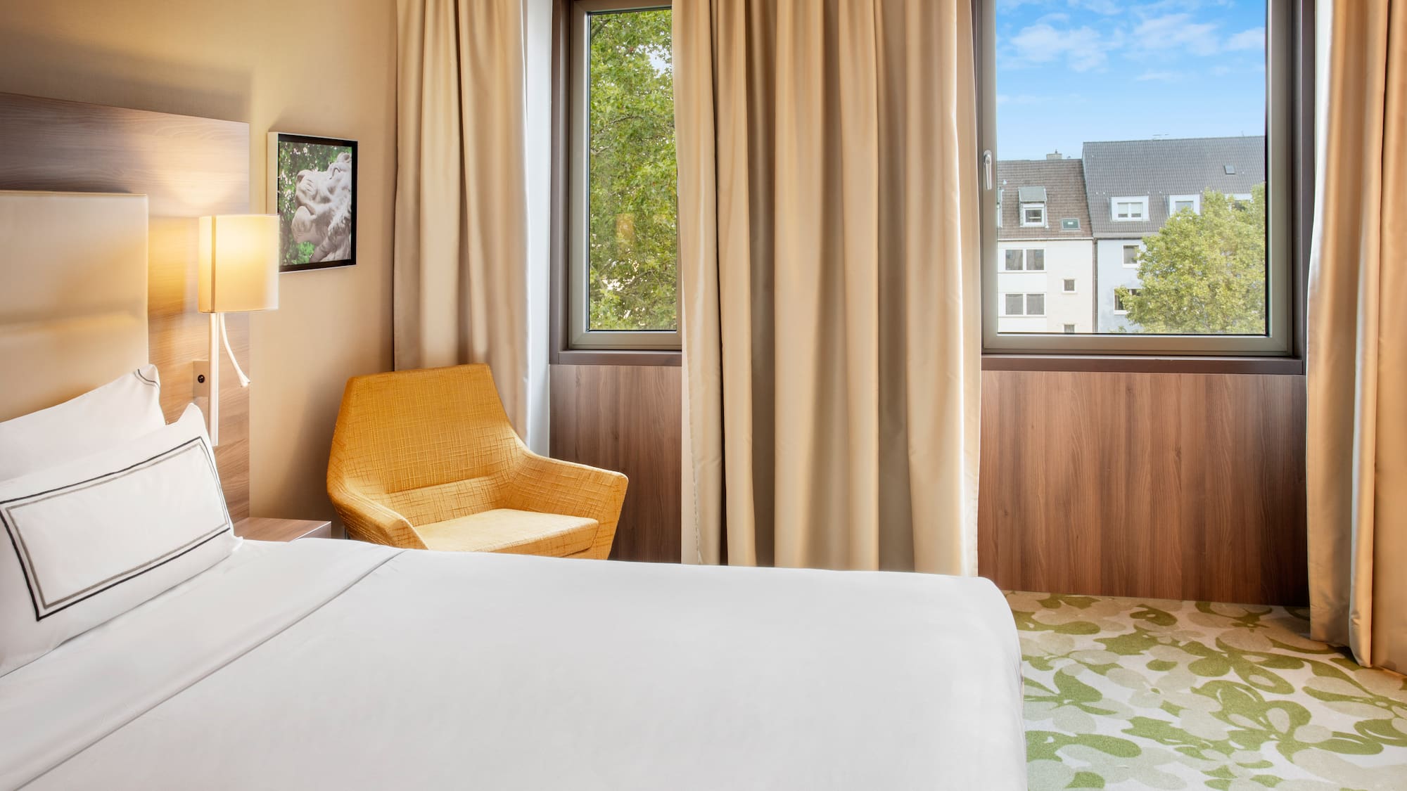 a room with a bed and a chair