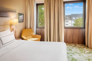 a room with a bed and a chair