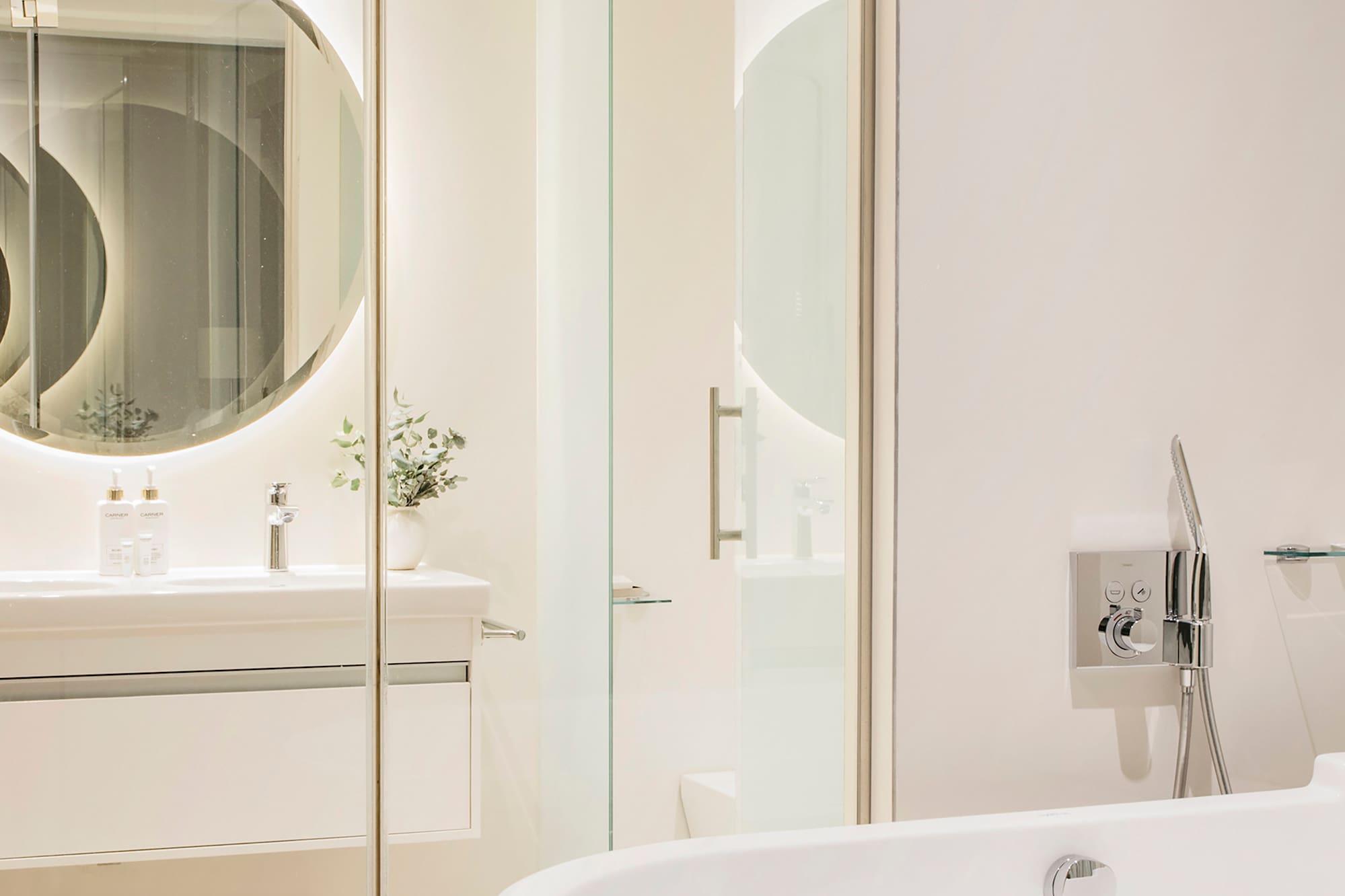 a bathroom with a tub and a mirror