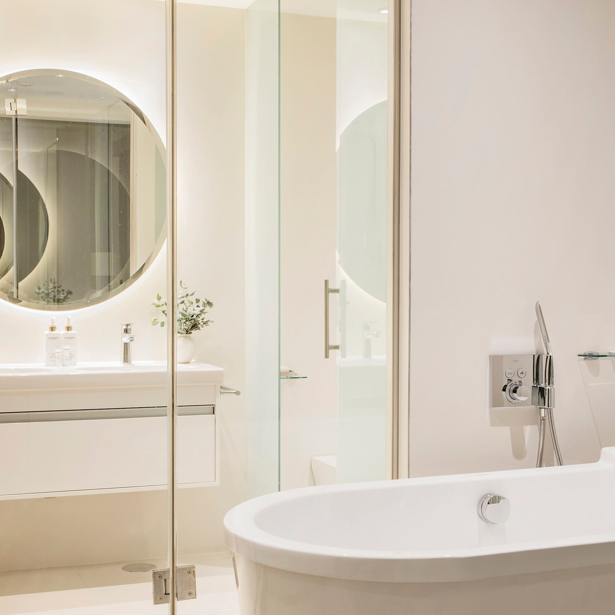 a bathroom with a tub and a mirror