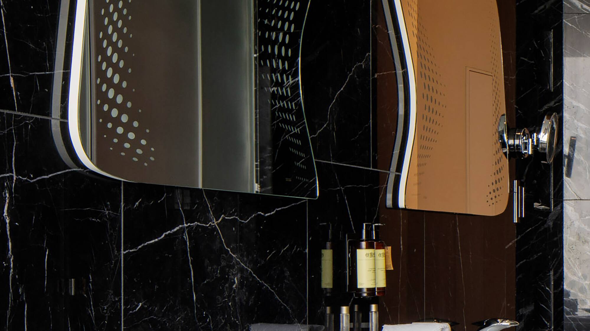 a bathroom with a mirror and sink