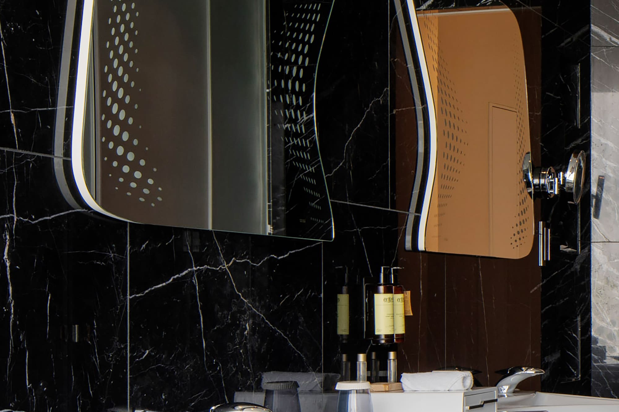 a bathroom with a mirror and sink