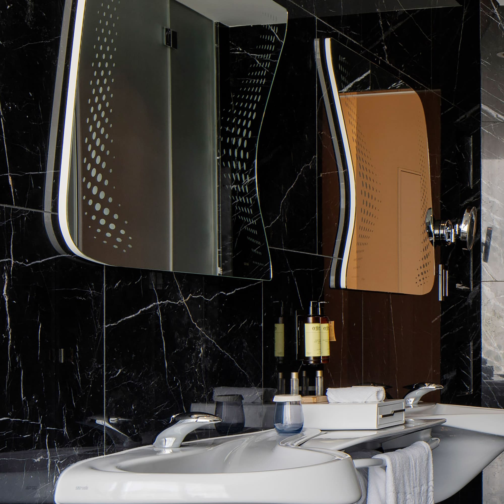 a bathroom with a mirror and sink