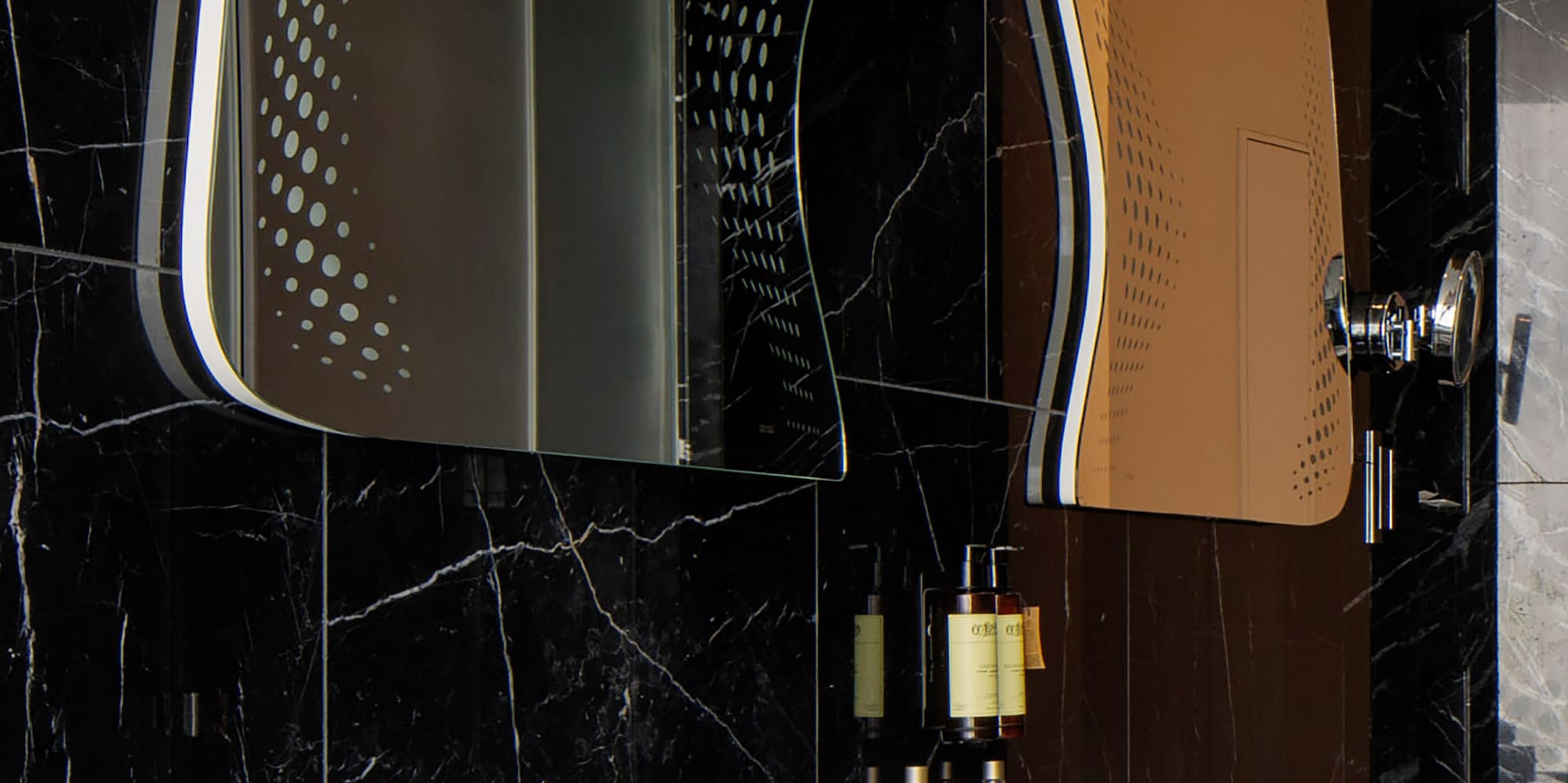 a bathroom with a mirror and sink