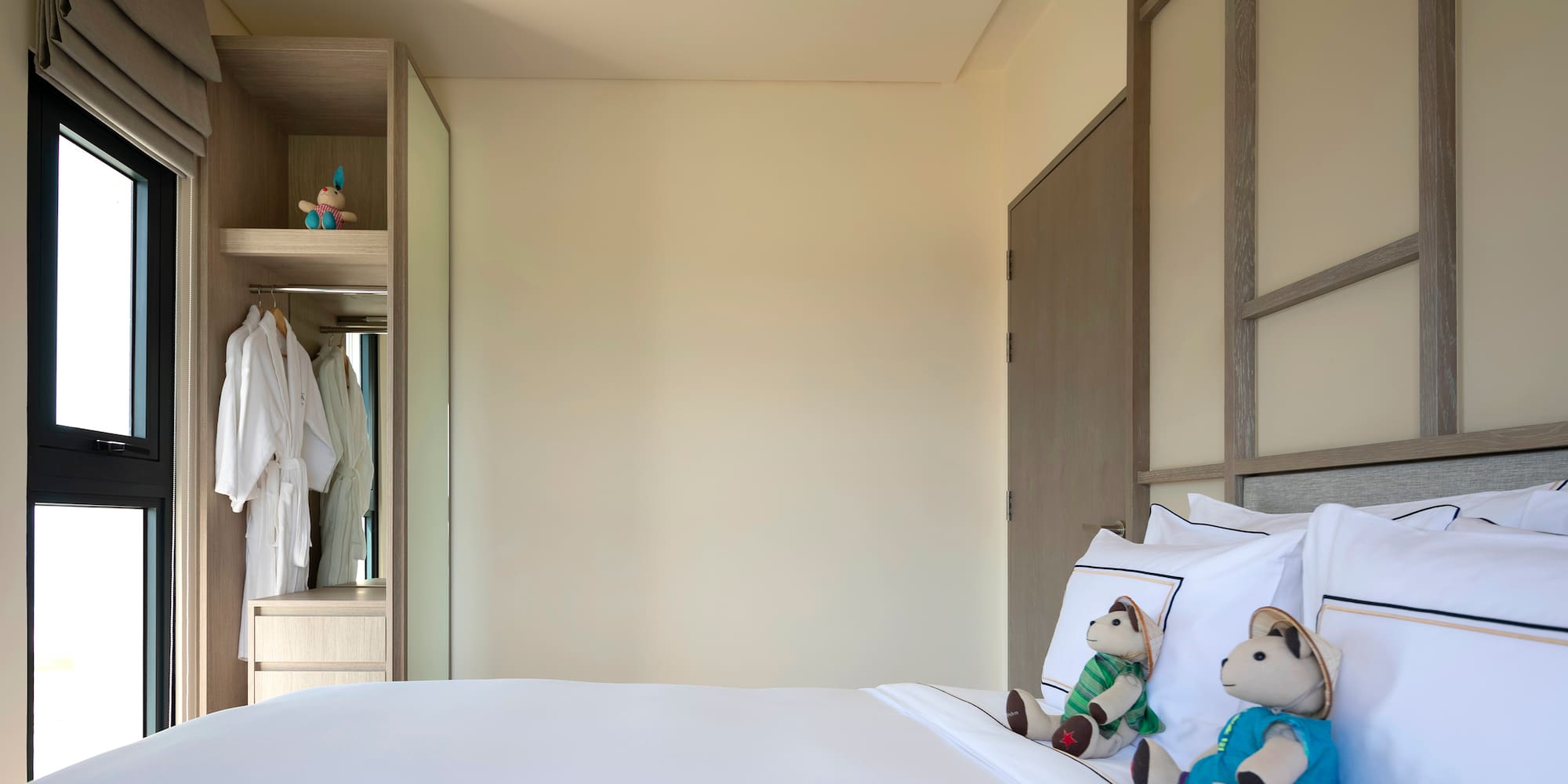 a bed with stuffed animals on it