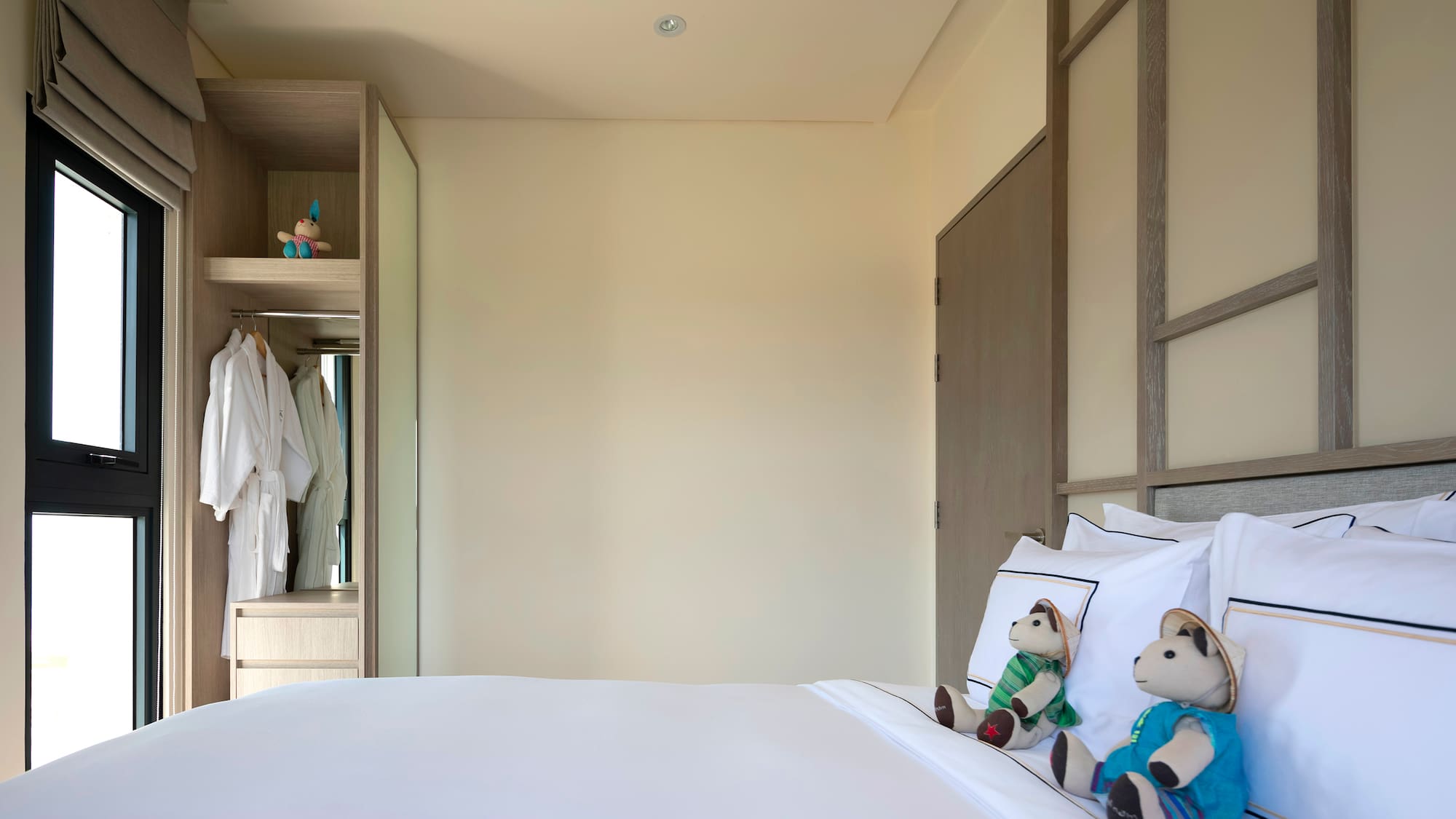 a bed with stuffed animals on it