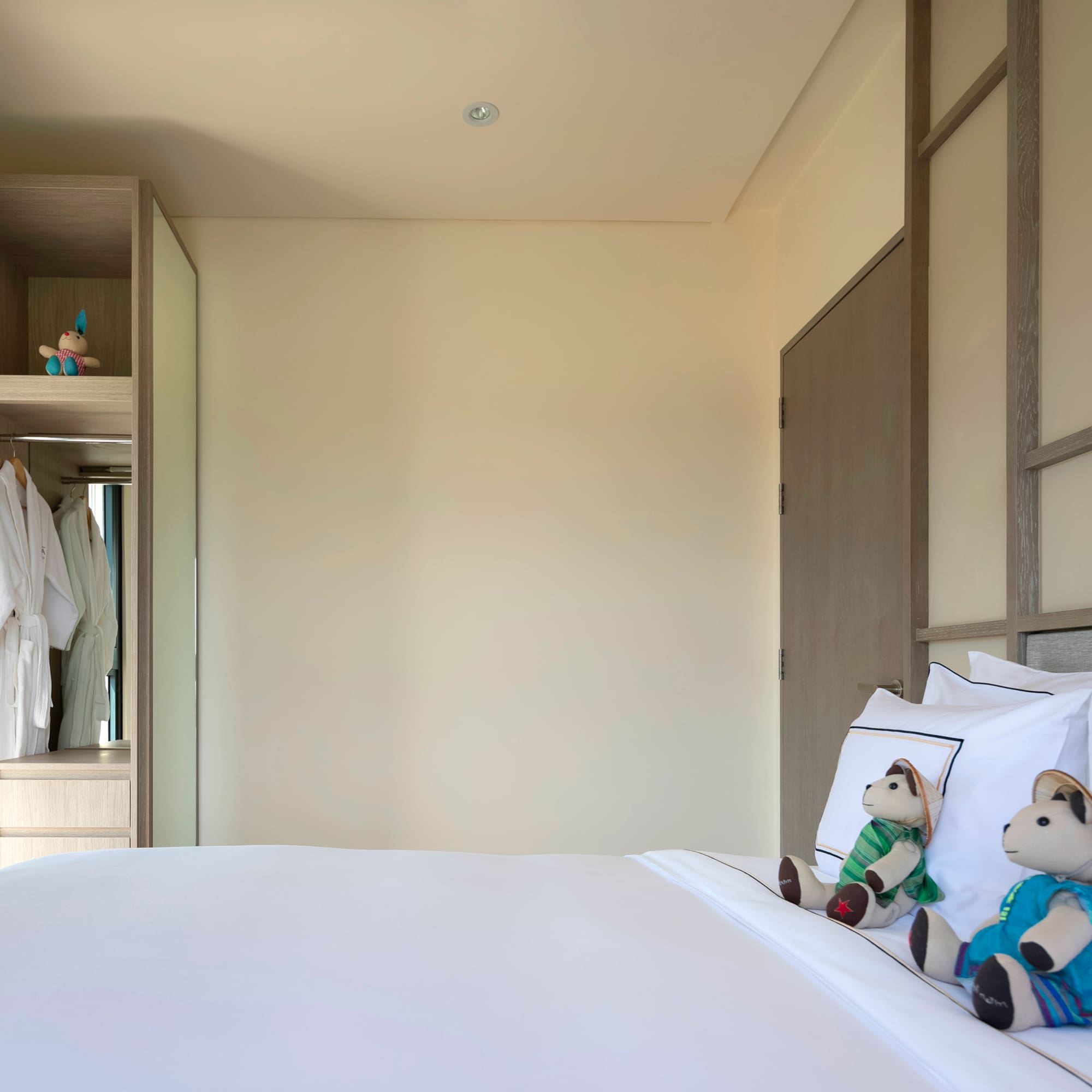 a bed with stuffed animals on it