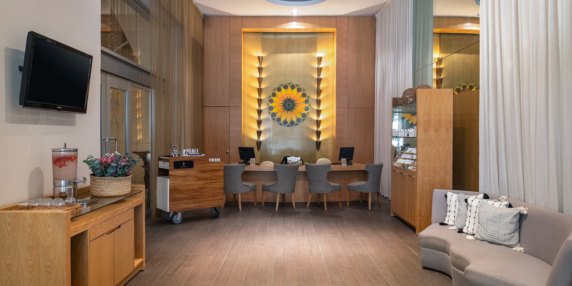 a room with a desk and chairs