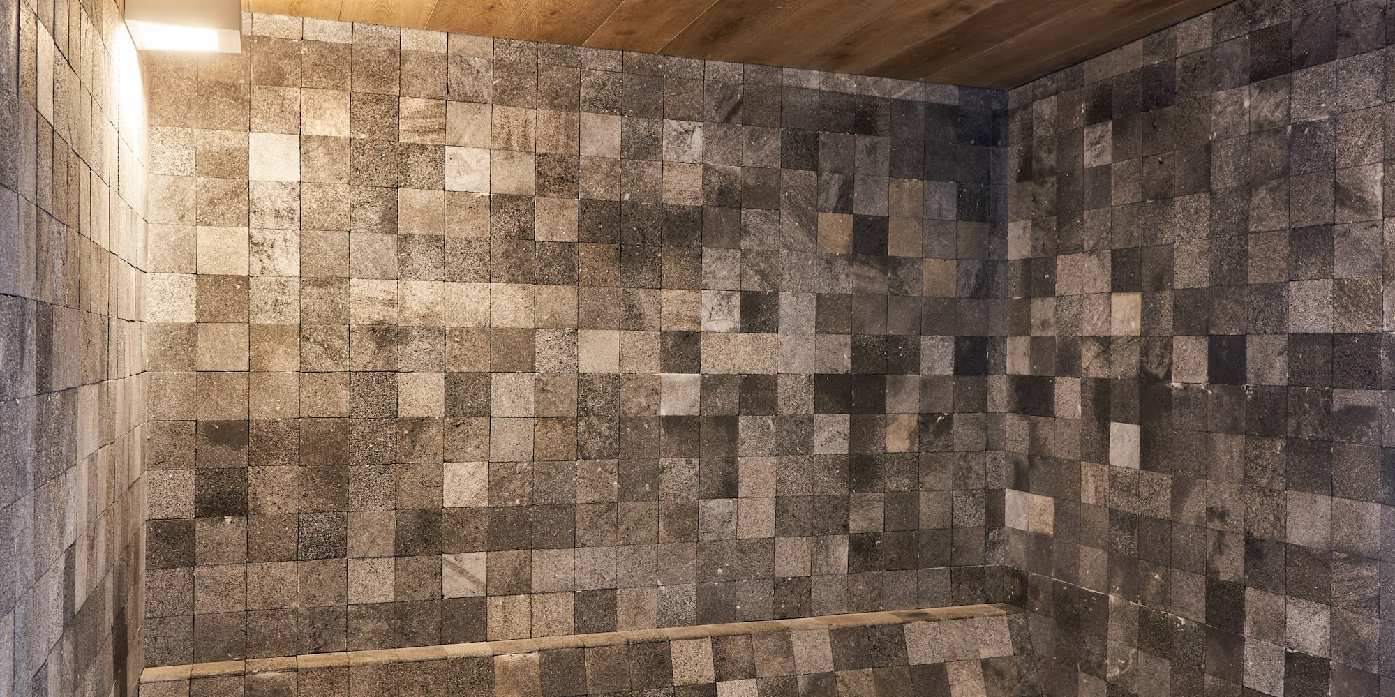 a stone bench in a room