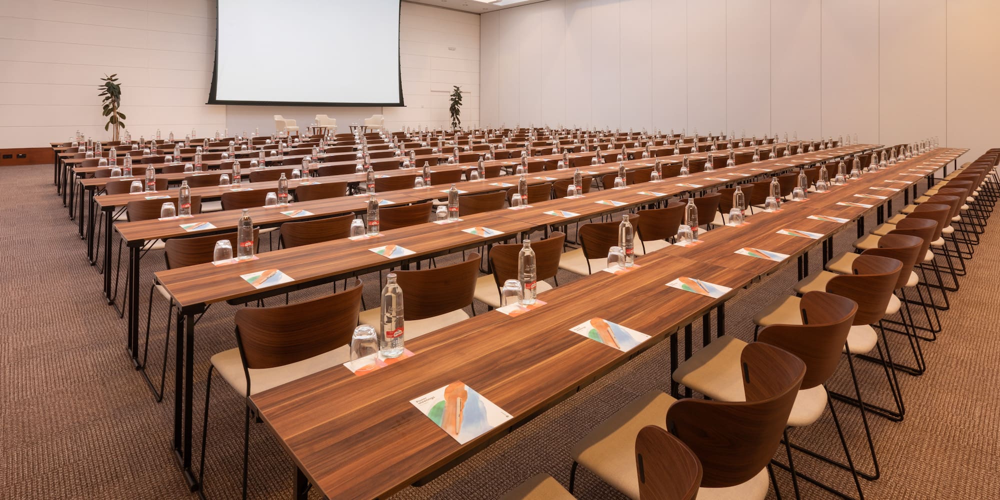 a large conference room with tables and chairs