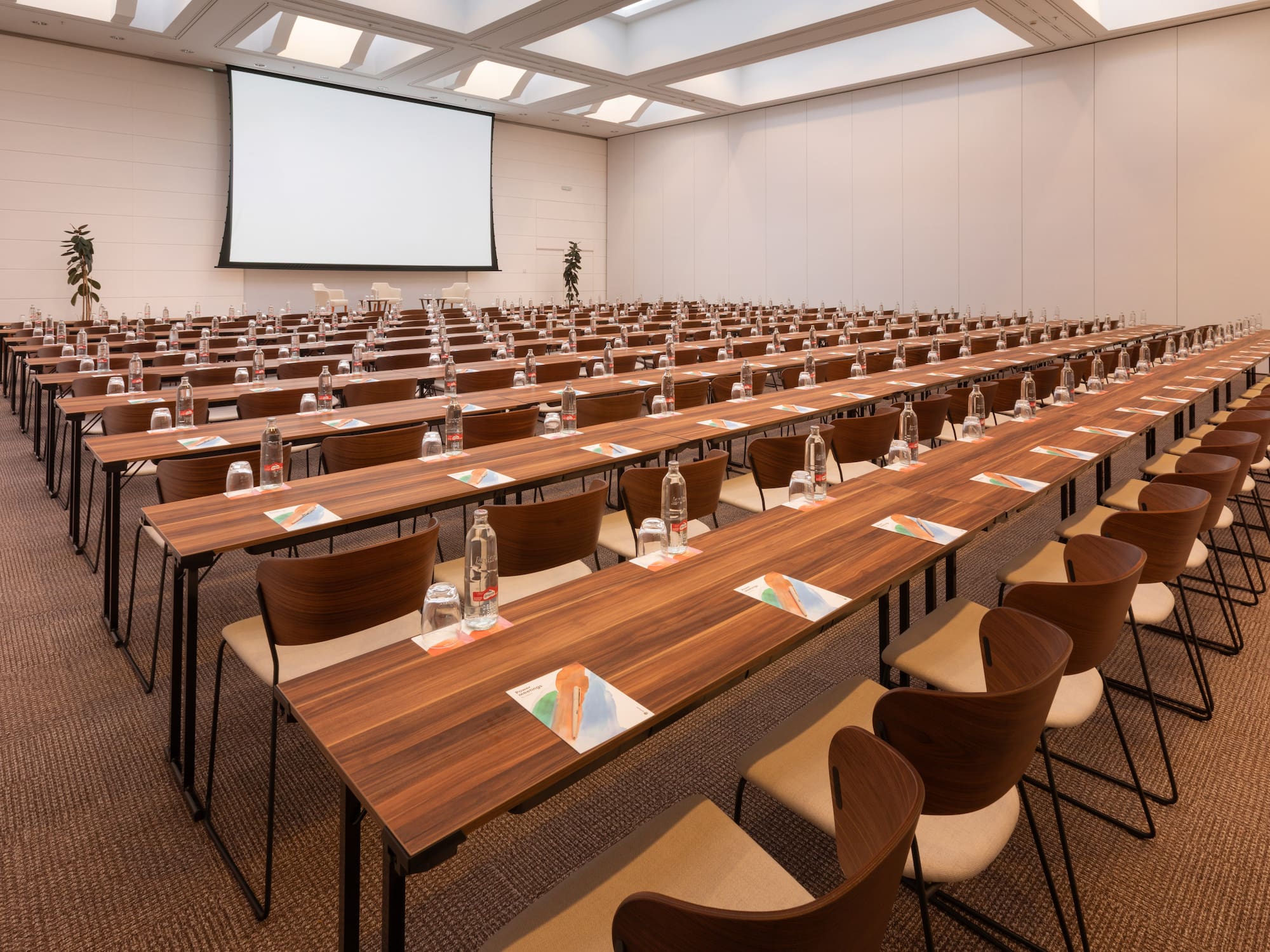 a large conference room with tables and chairs