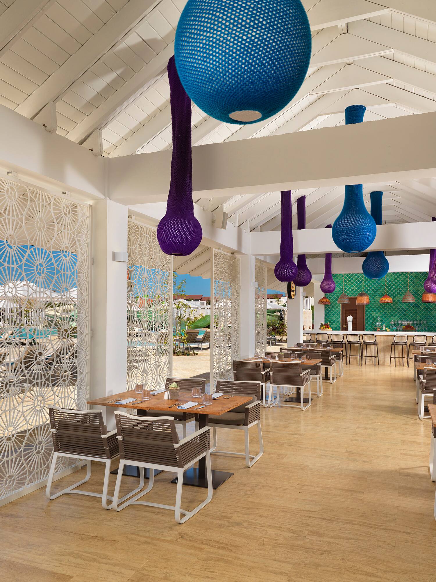 a restaurant with tables and chairs