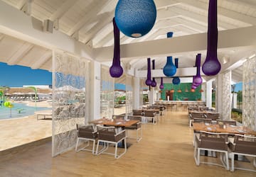 a restaurant with tables and chairs