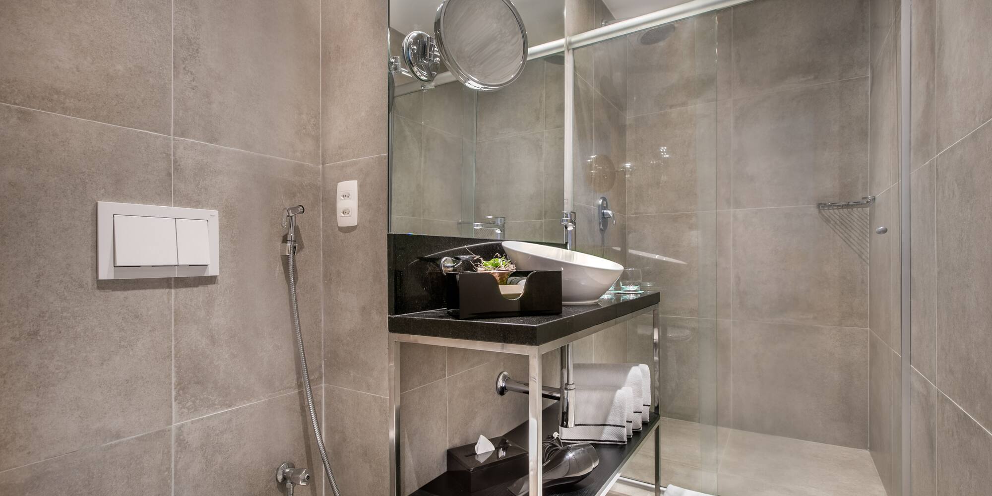 a bathroom with a glass shower door