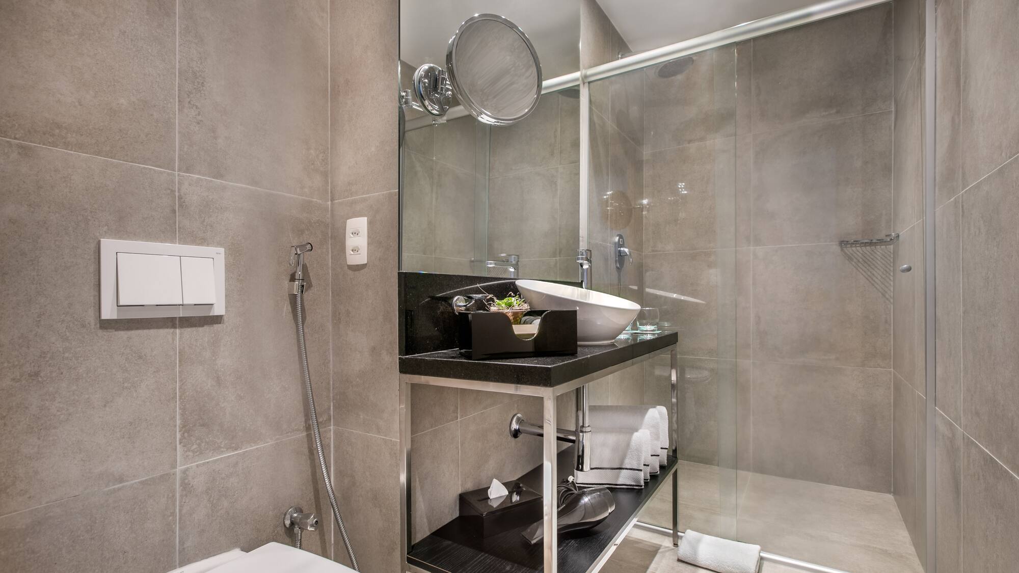 a bathroom with a glass shower door