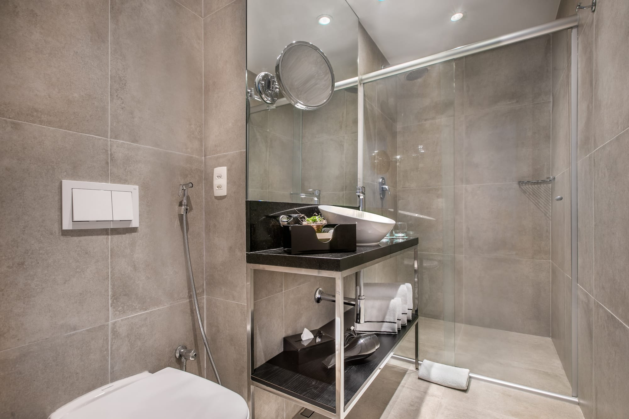 a bathroom with a glass shower door