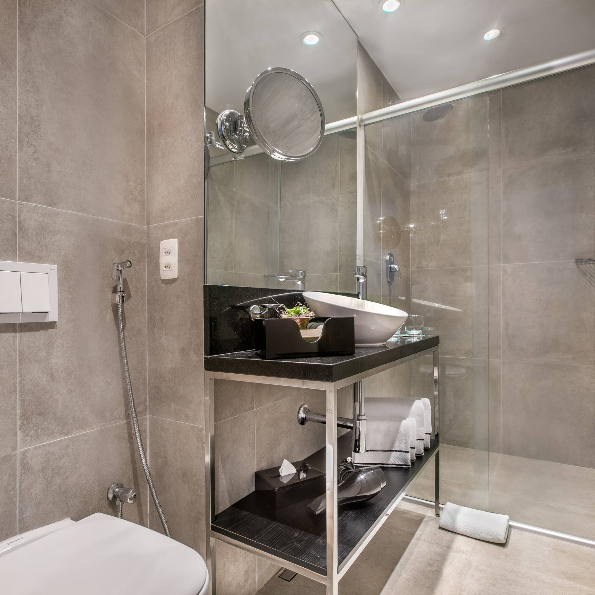 a bathroom with a glass shower door