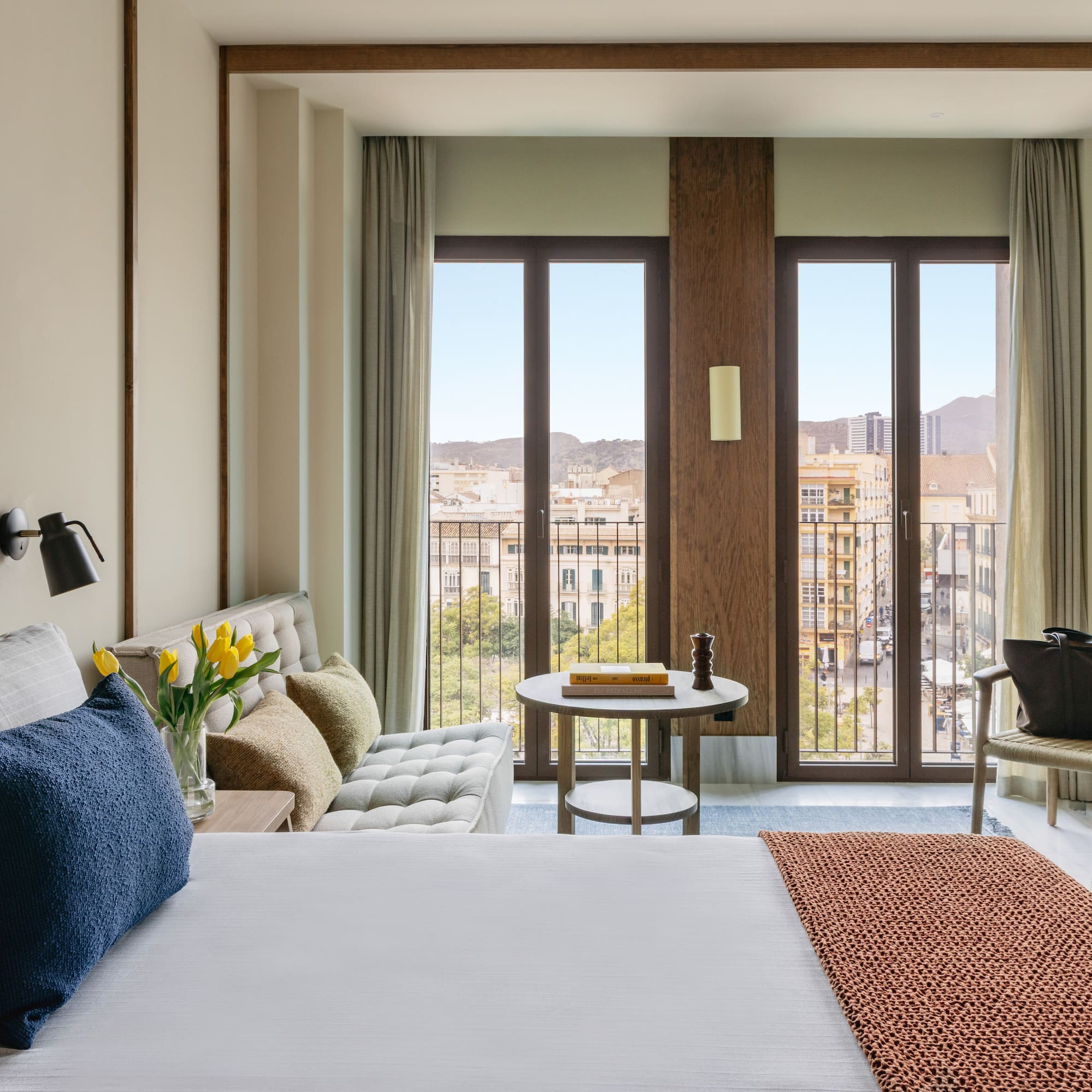 a bedroom with a bed and a couch