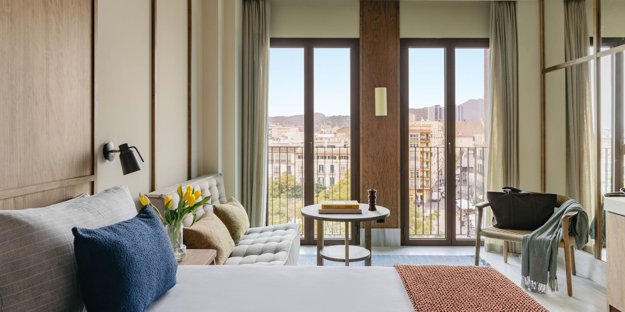 a bedroom with a bed and a couch