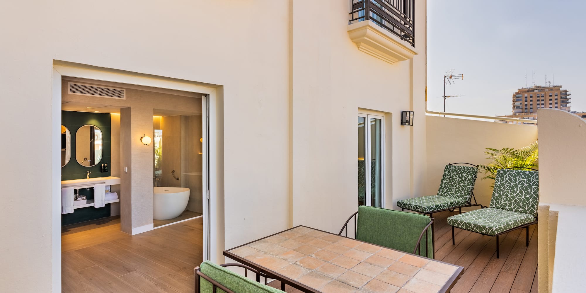 a patio with chairs and a bathtub