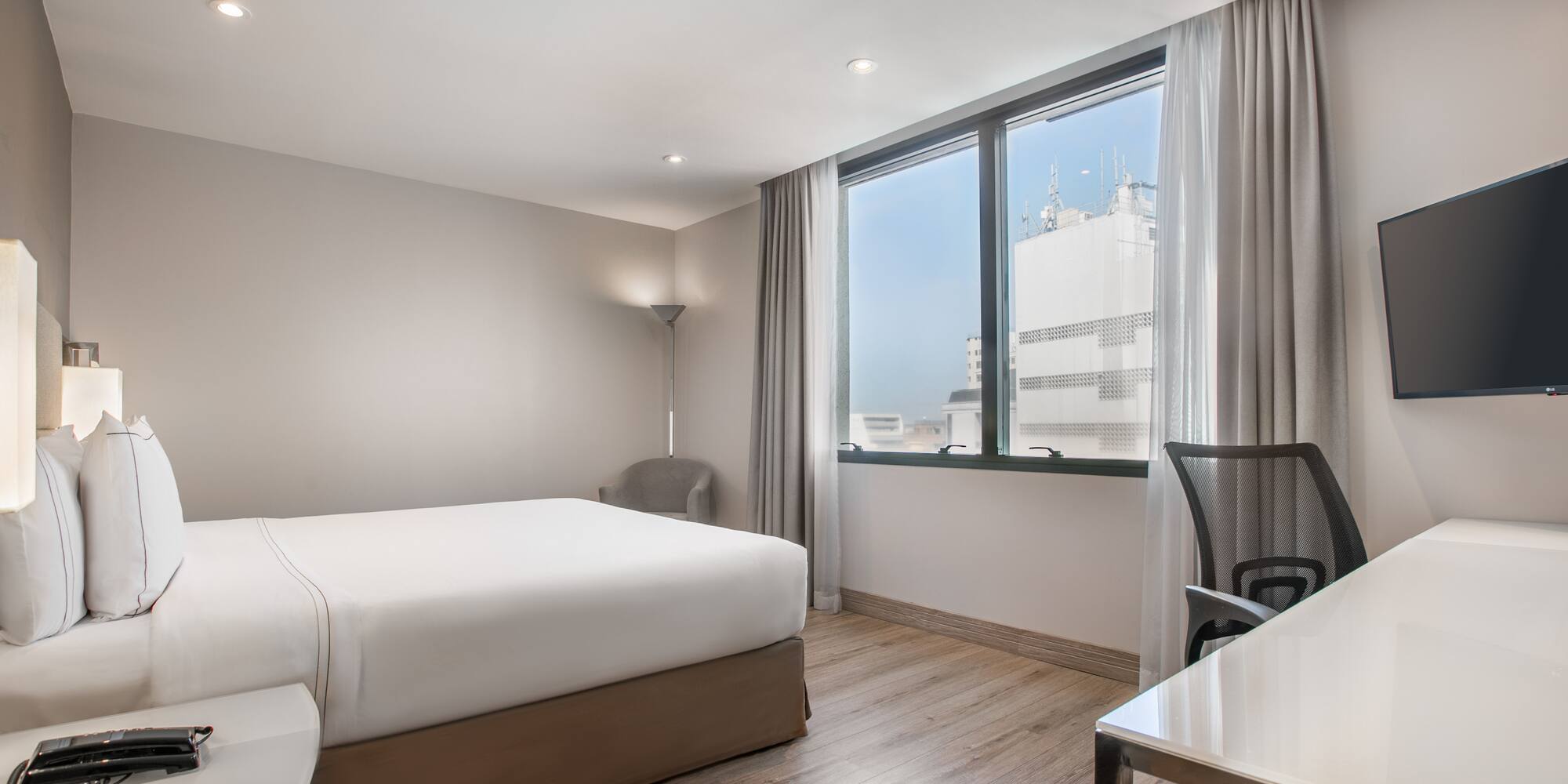 a room with a bed and a desk