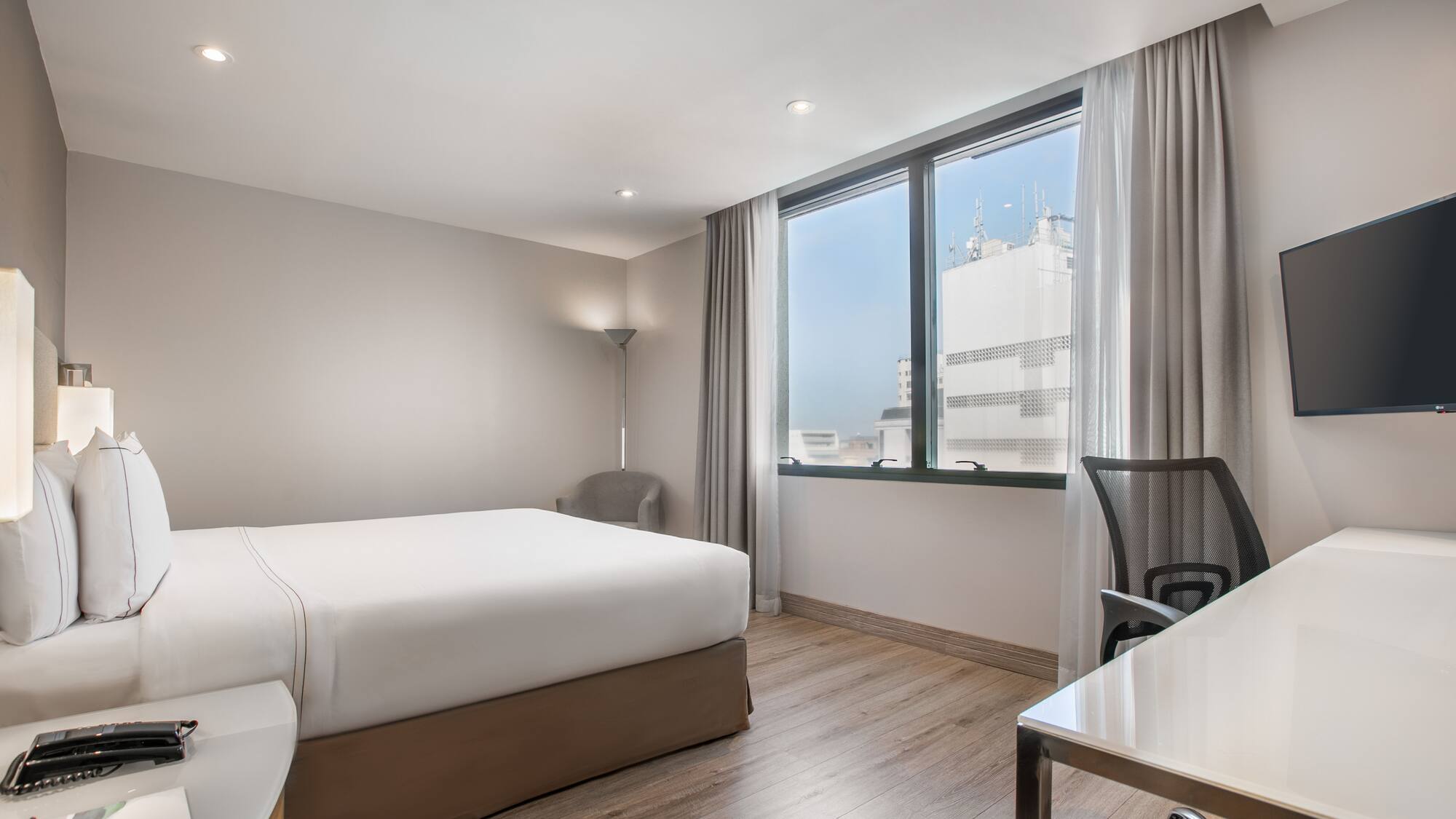 a room with a bed and a desk