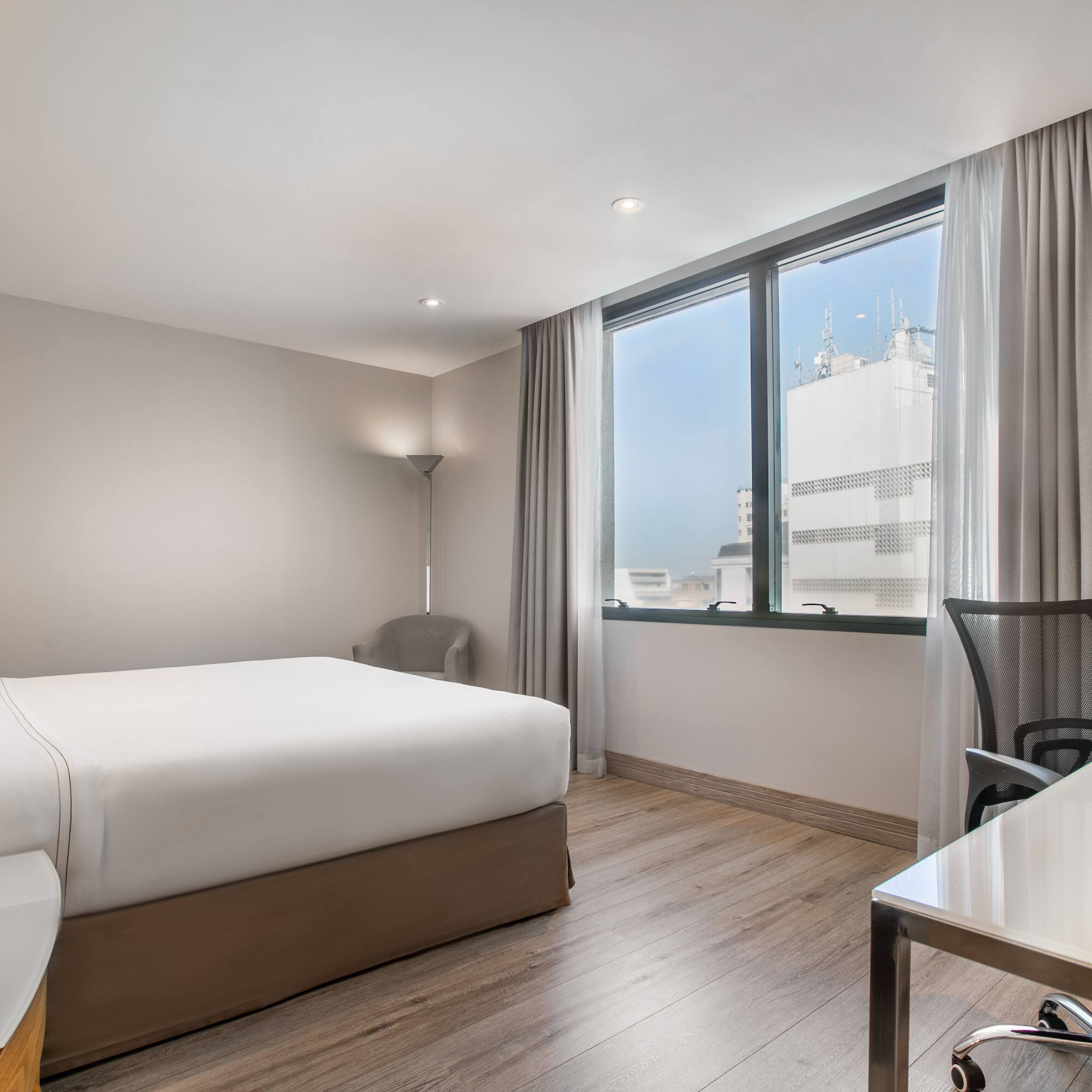 a room with a bed and a desk