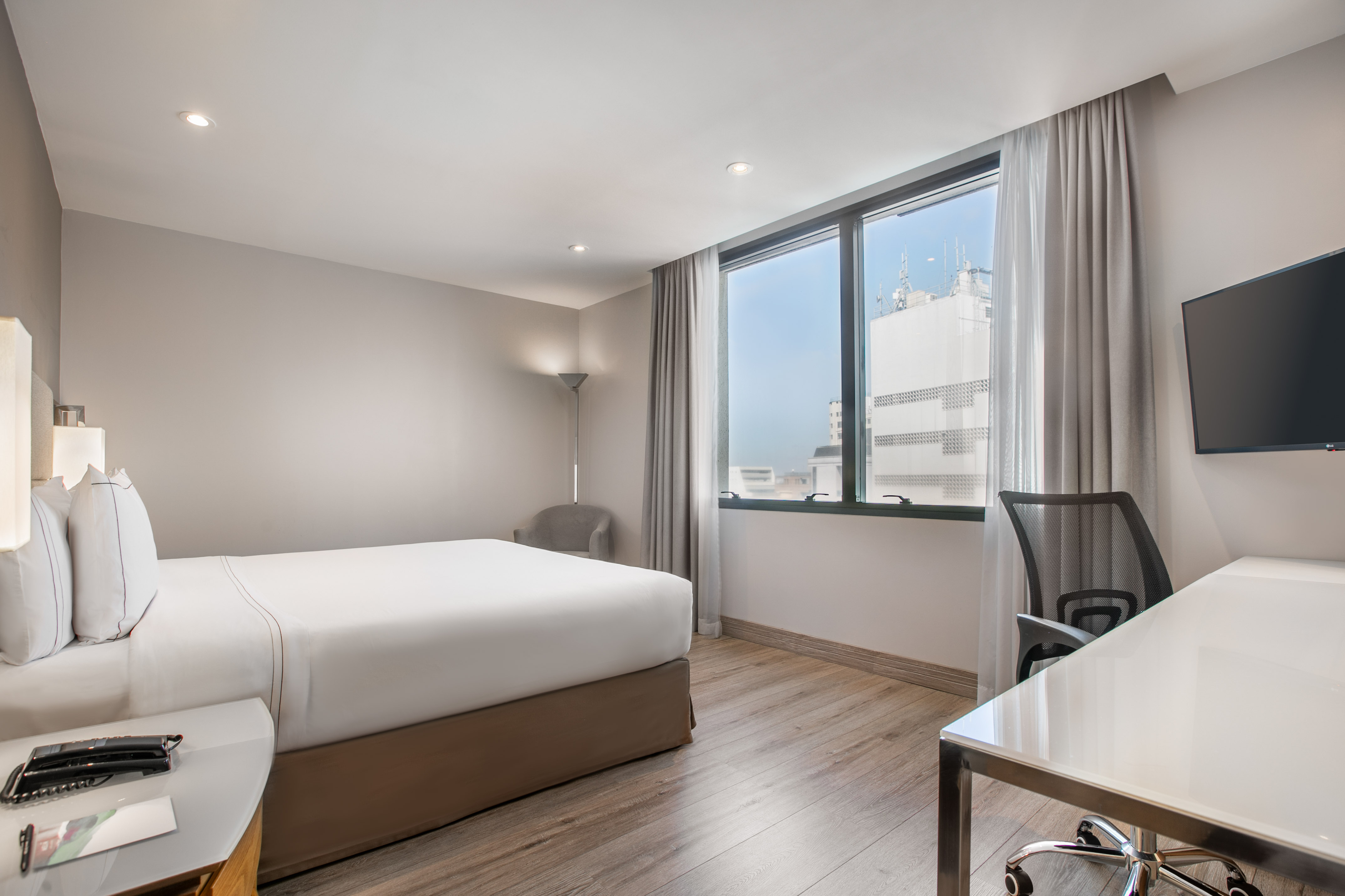 a room with a bed and a desk