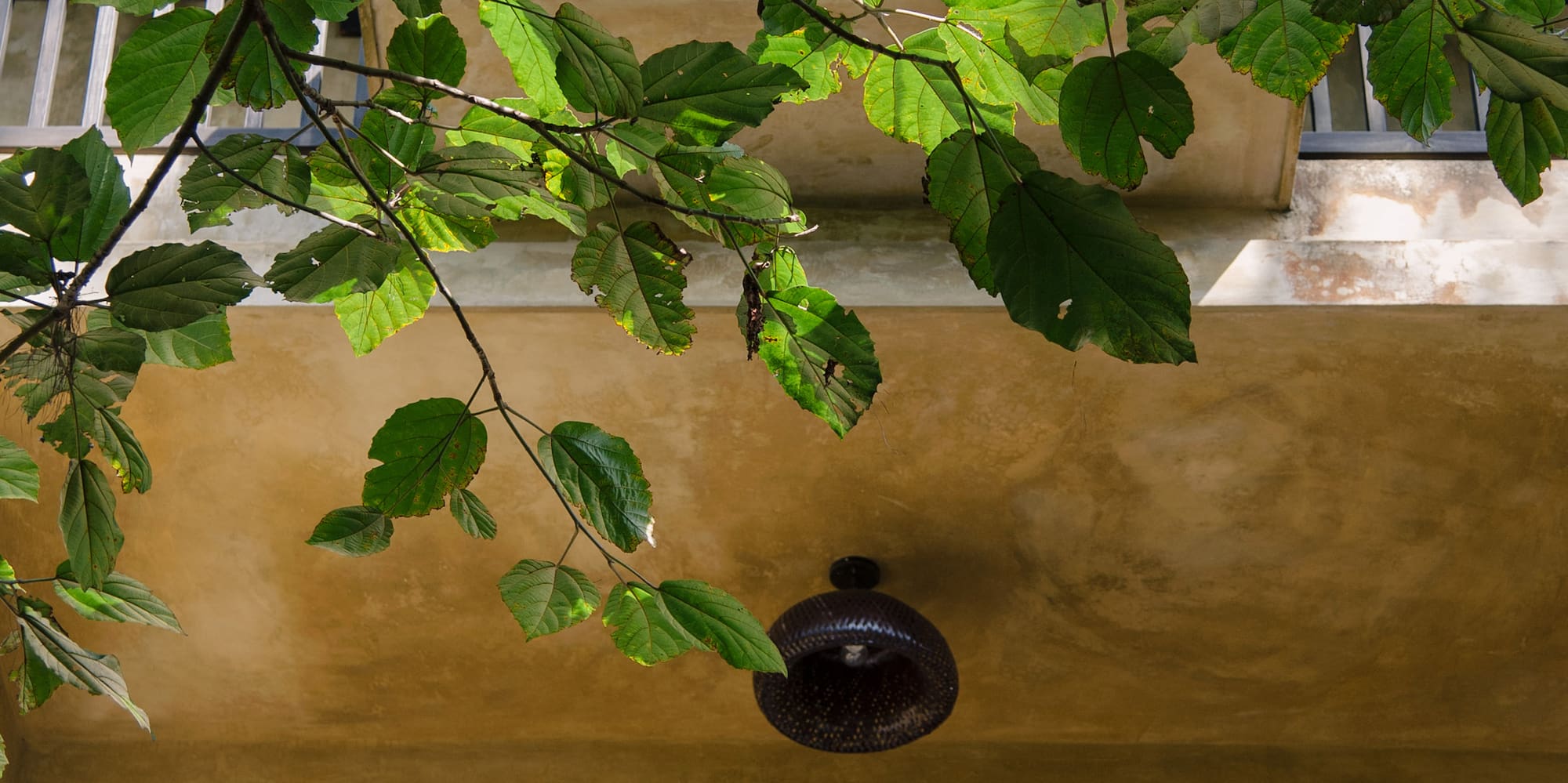 a balcony with a light fixture and a railing