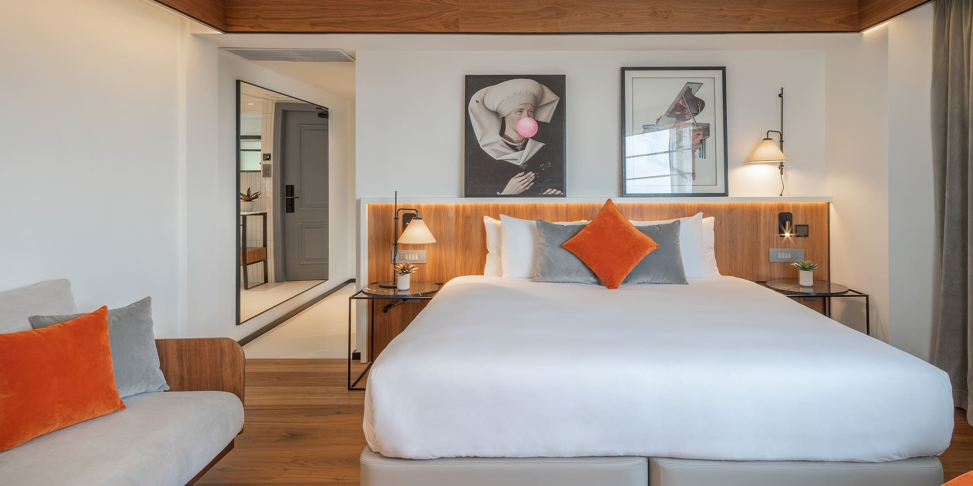 a bedroom with a bed and a couch