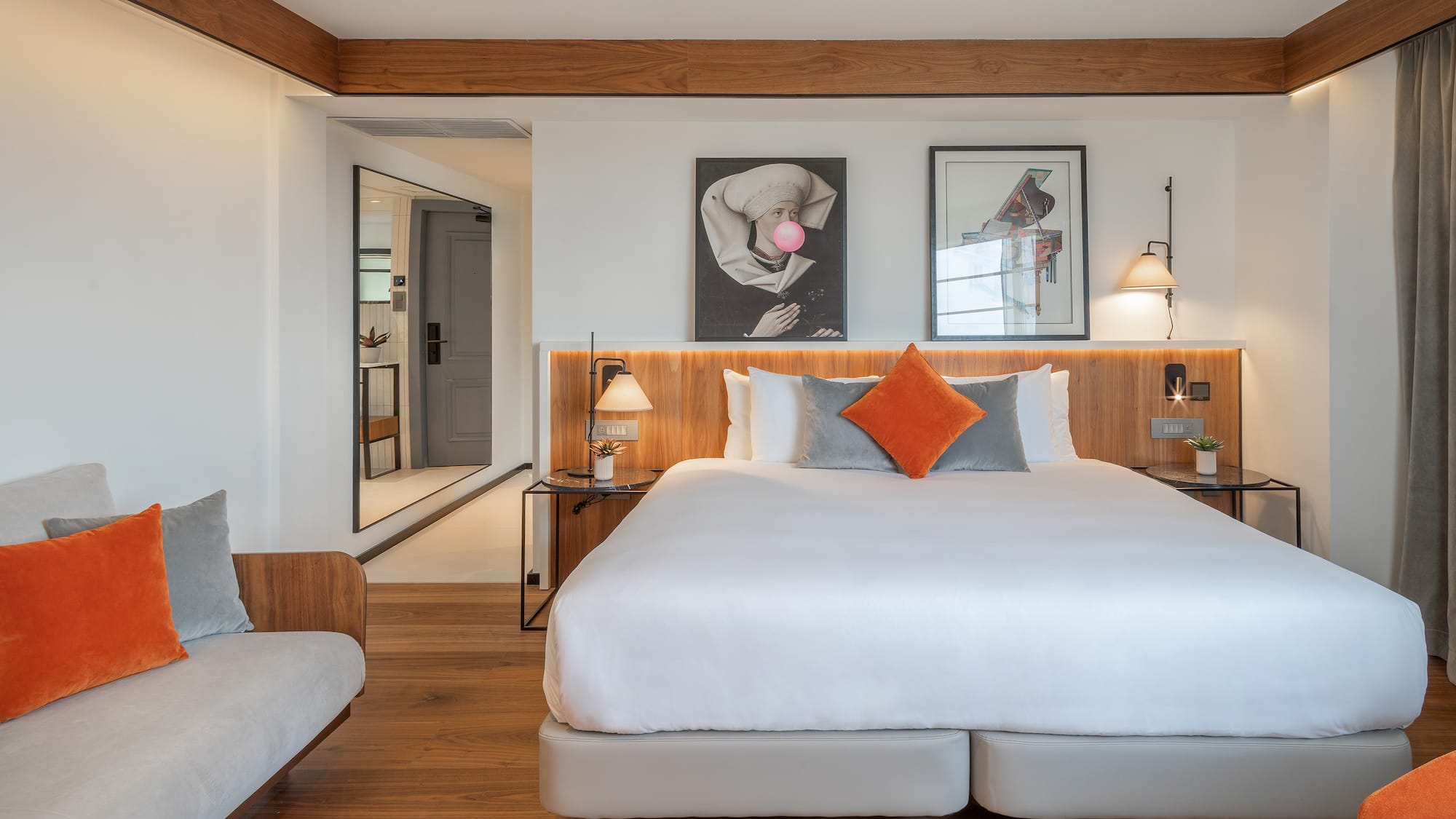 a bedroom with a bed and a couch