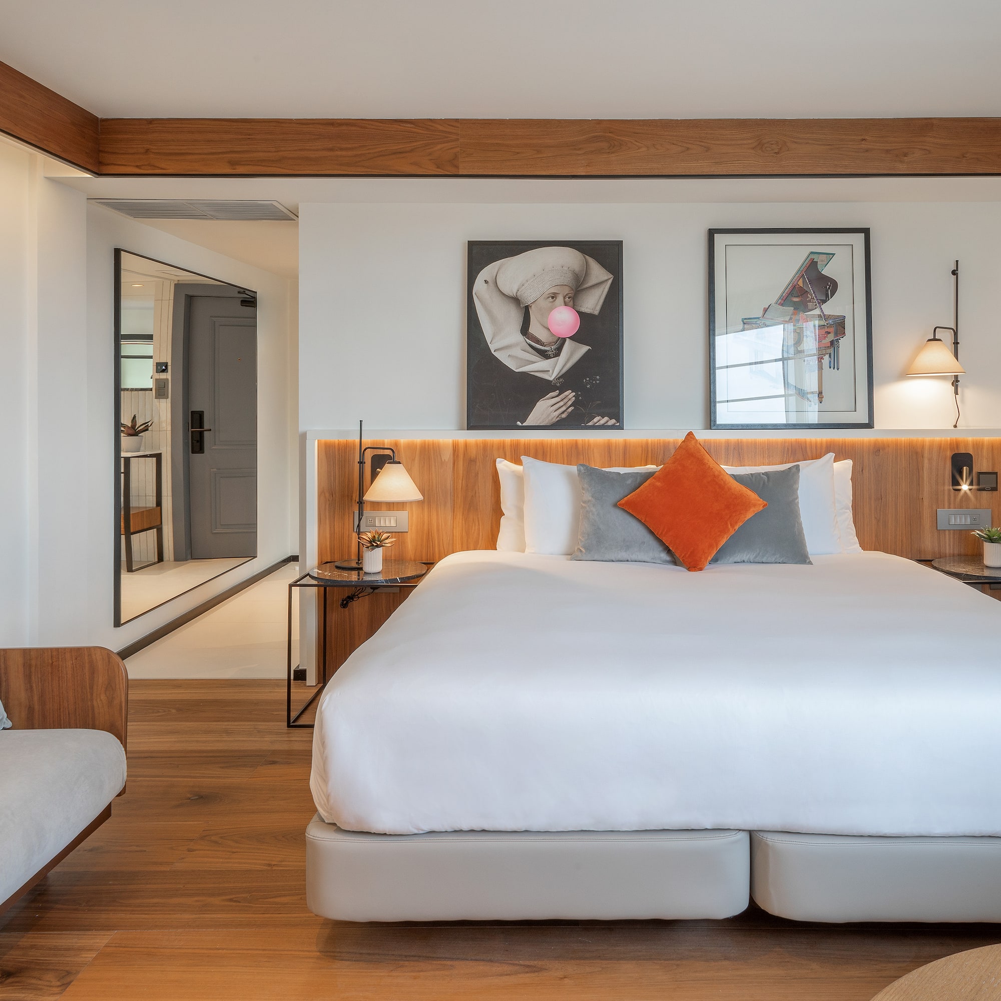 a bedroom with a bed and a couch