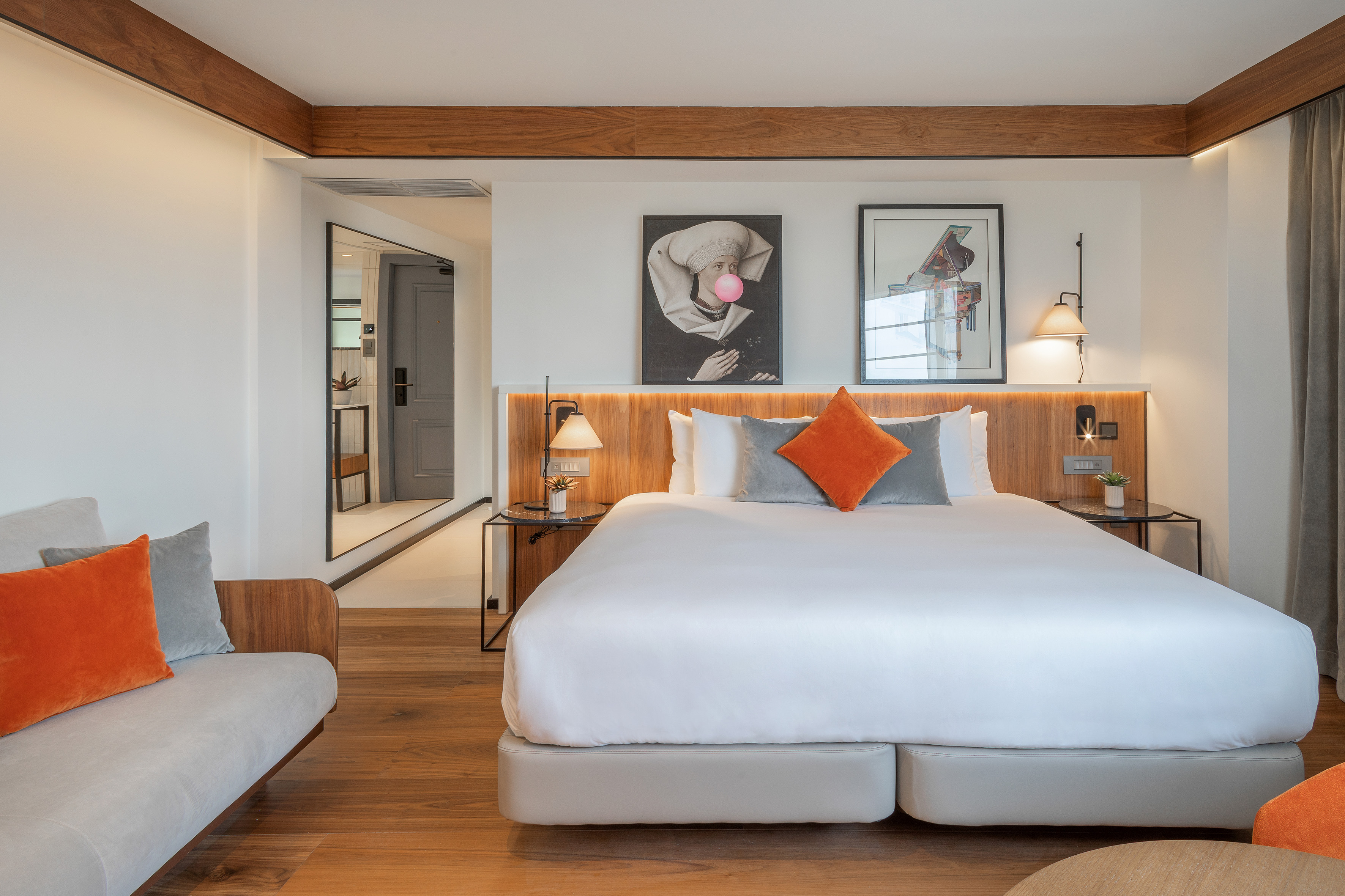 a bedroom with a bed and a couch