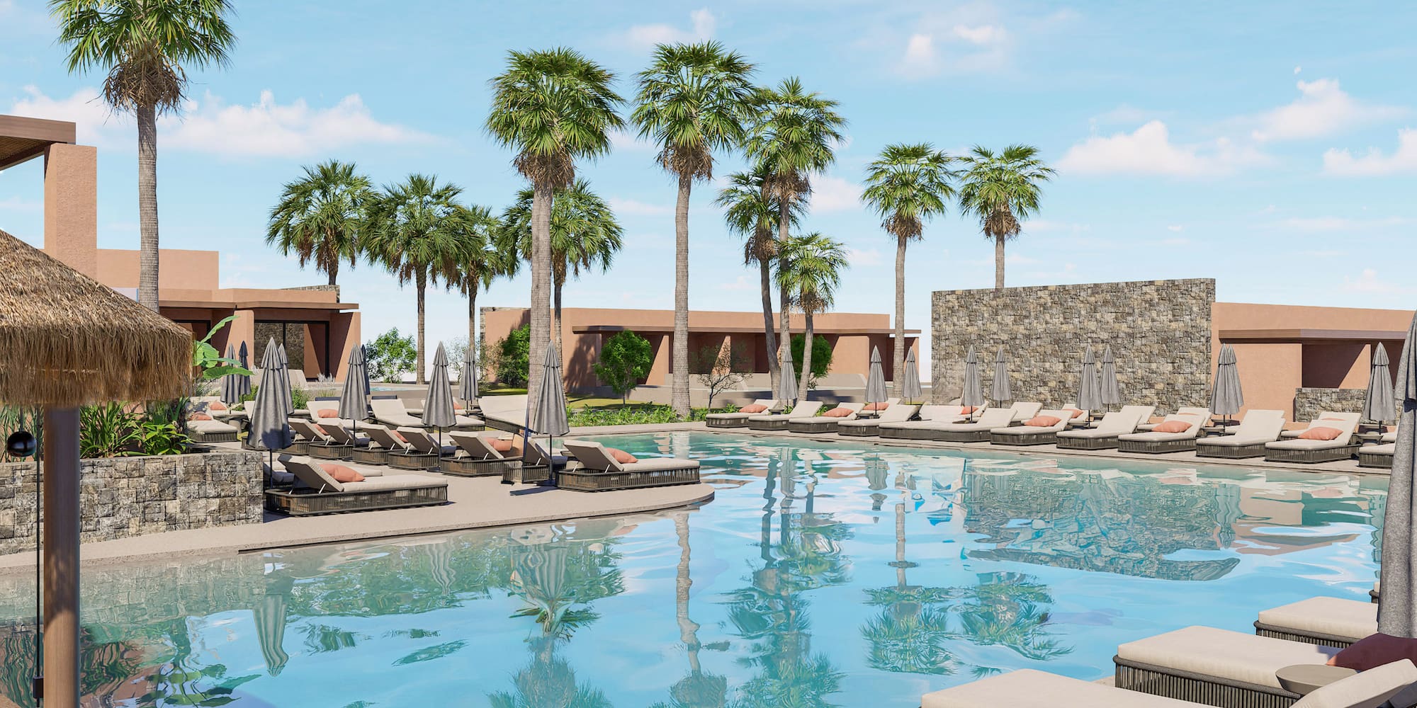 a pool with lounge chairs and palm trees