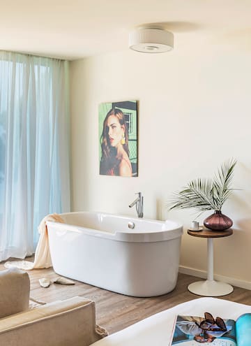 a white bathtub in a bathroom