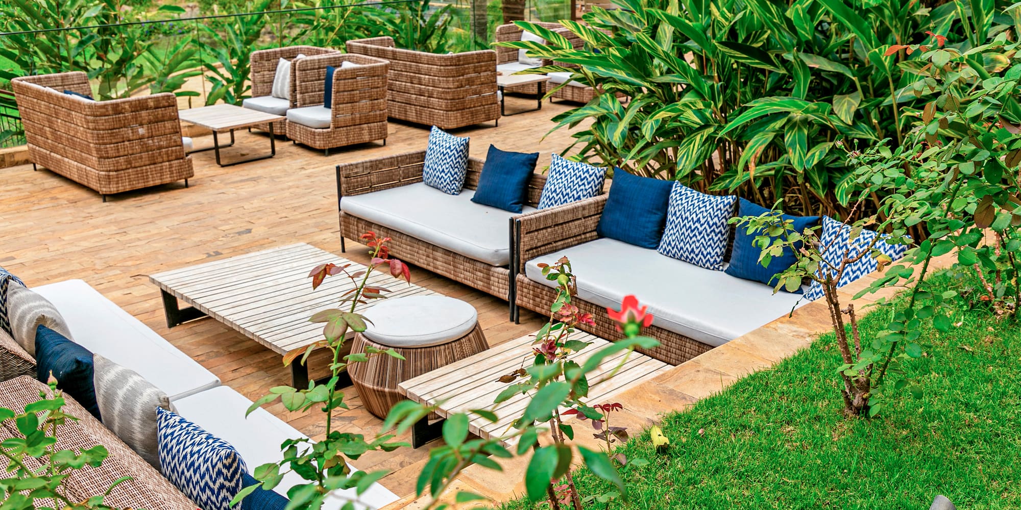 a patio area with chairs and tables