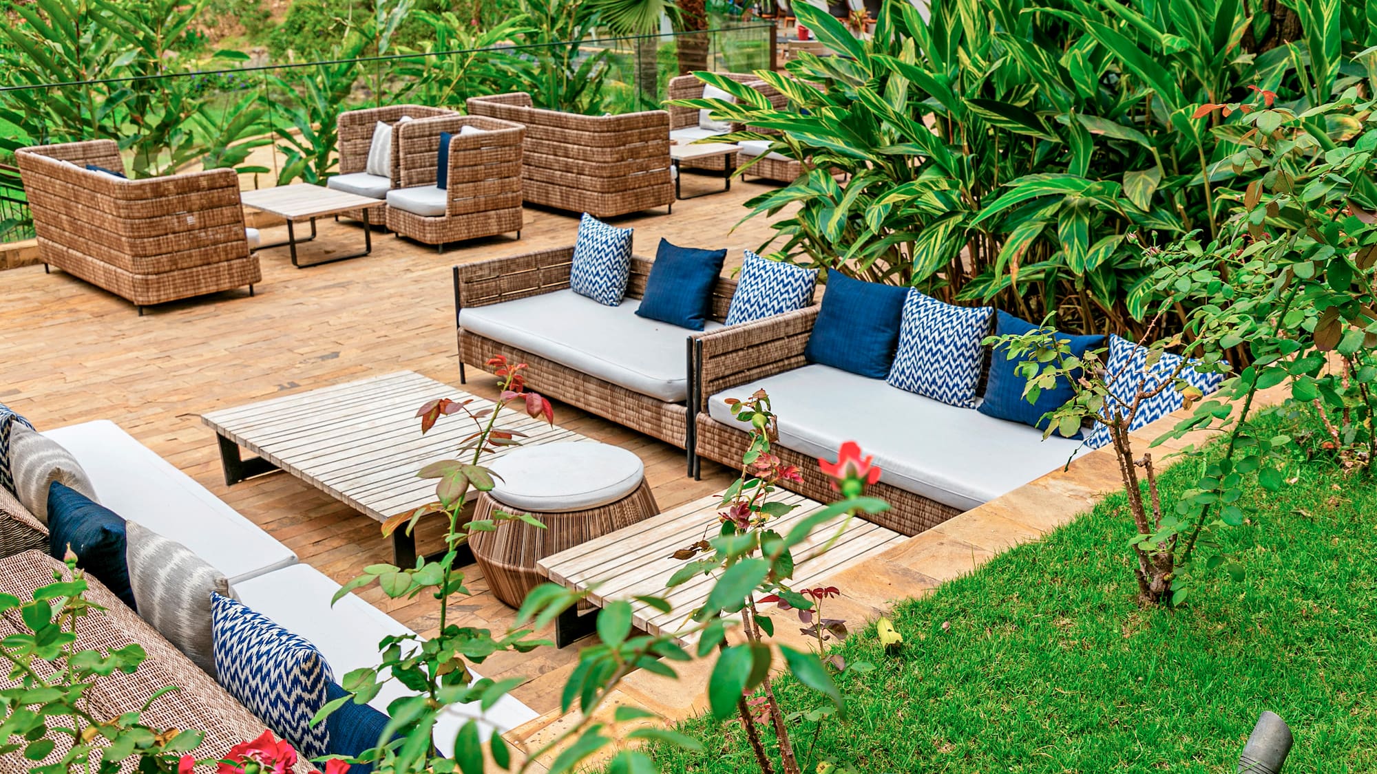 a patio area with chairs and tables
