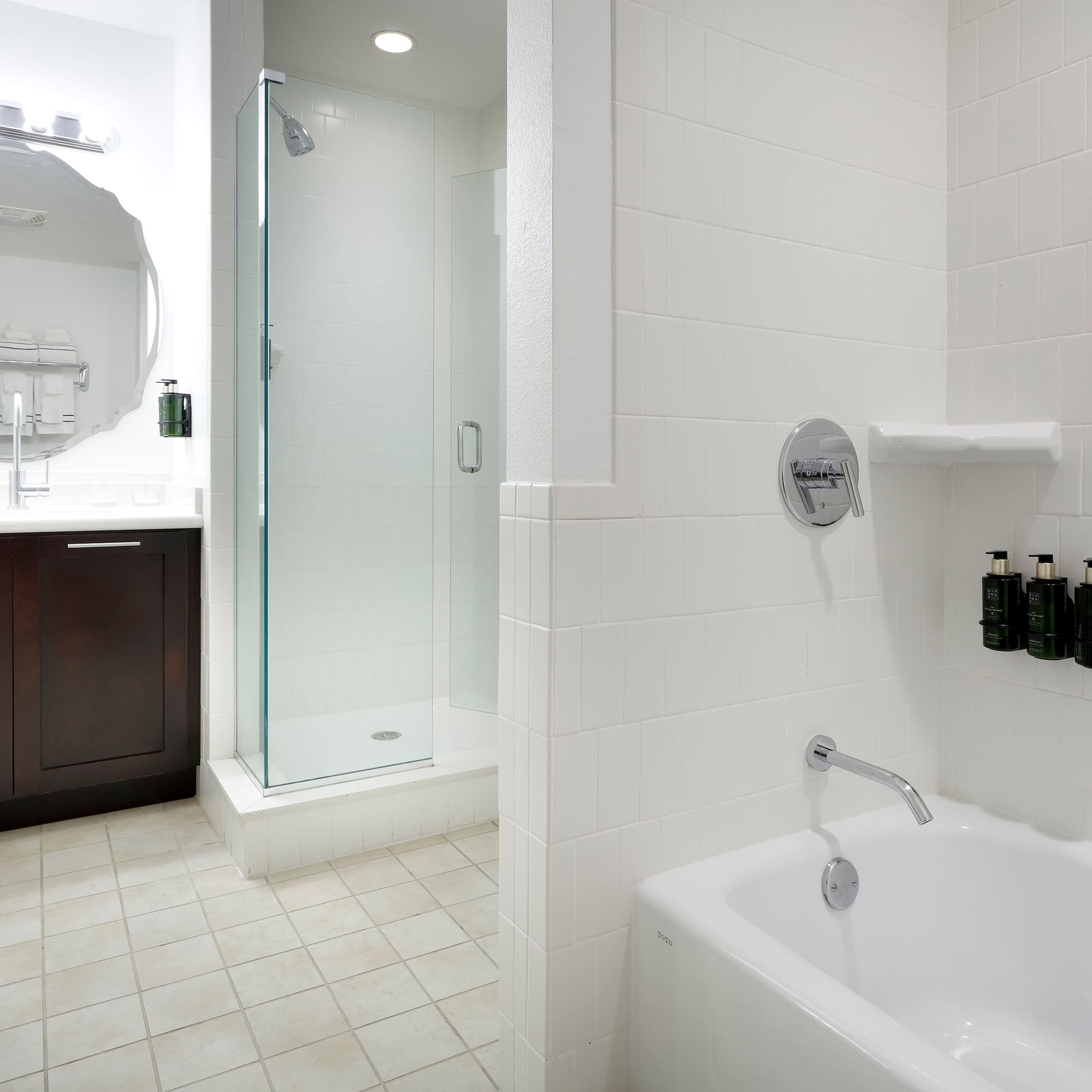 a bathroom with a tub and shower